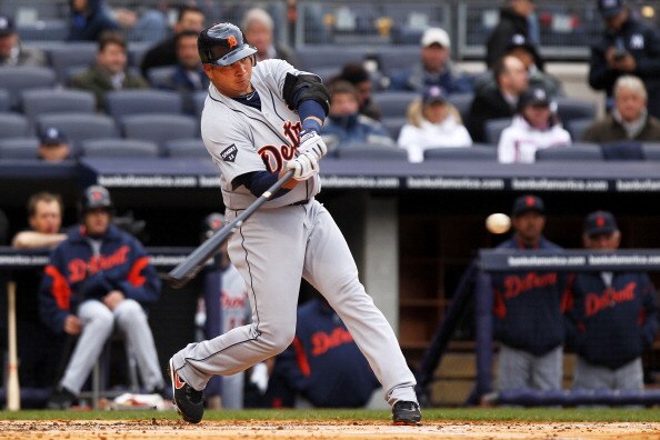 NEW YORK, NY - MARCH 31:  Jhonny Peralta #27 of the Detroit Tigers hits a sacrifice fly in the top of the fourth inning to bring in Miguel Cabrera #24 against the New York Yankees on Opening Day at Yankee Stadium on March 31, 2011 in New York City.  (Phot