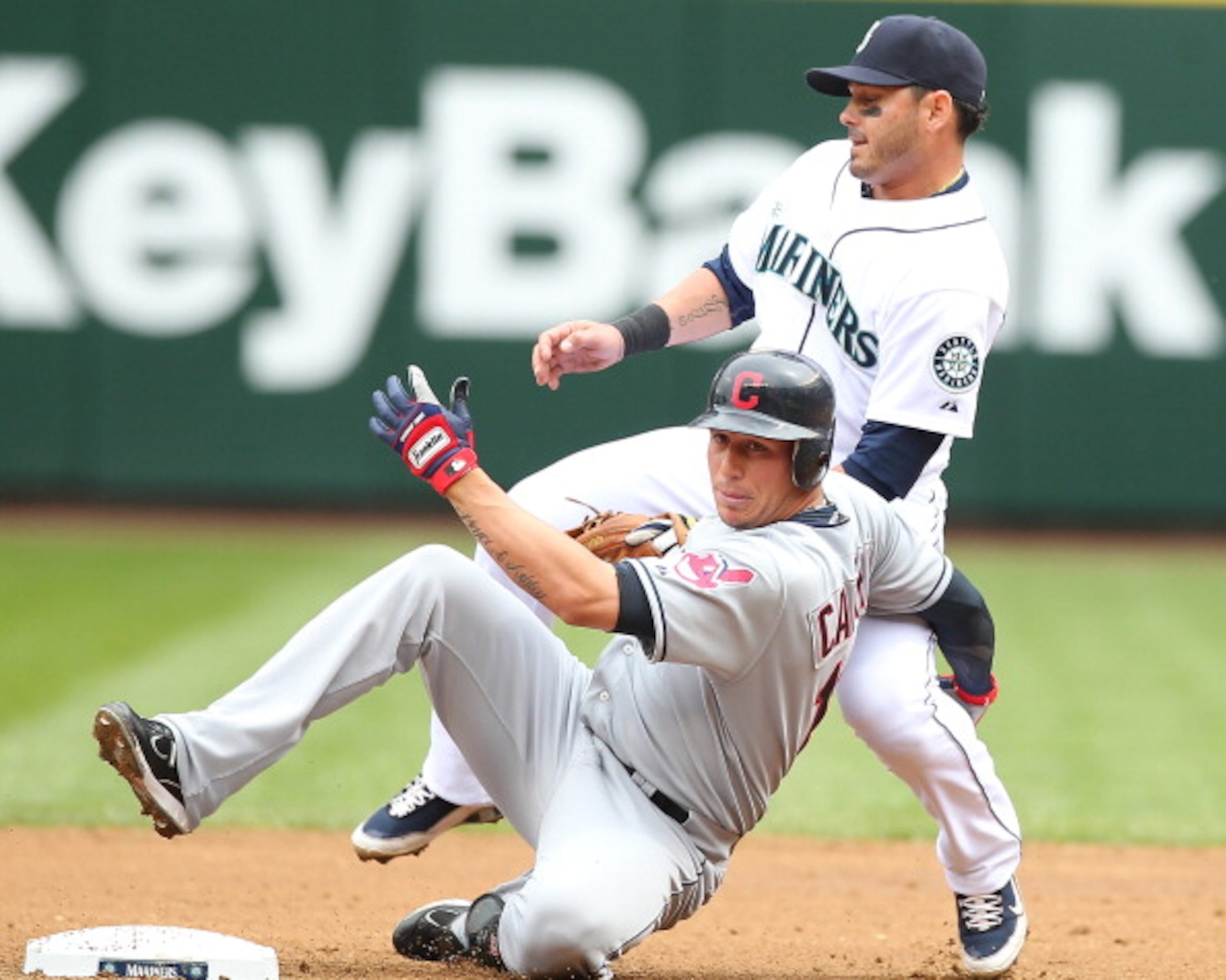 SEATTLE - APRIL 10:  Asdrubal Cabrera #13 of the Cleveland Indians is put out at second base by Luis Rodriguez #1 of the Seattle Mariners to end the top of the second inning at Safeco Field on April 10, 2011 in Seattle, Washington. (Photo by Otto Greule J