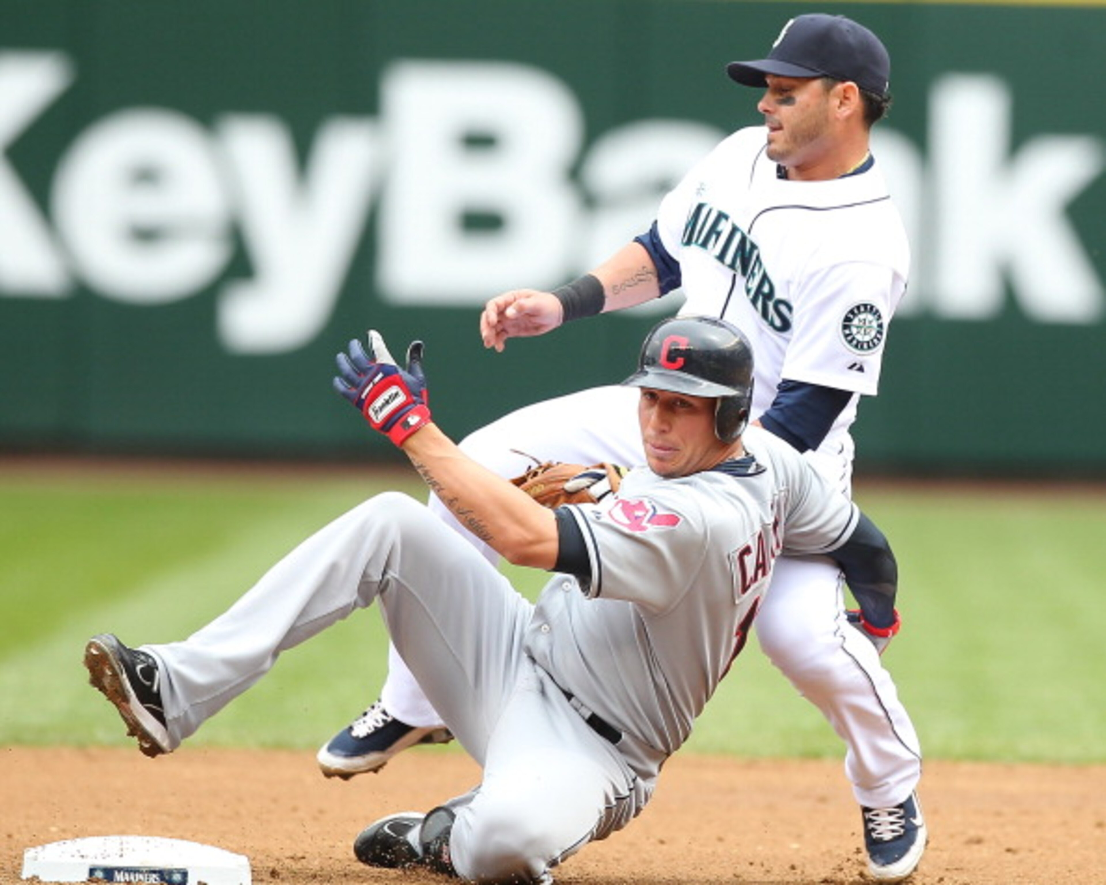 SEATTLE - APRIL 10:  Asdrubal Cabrera #13 of the Cleveland Indians is put out at second base by Luis Rodriguez #1 of the Seattle Mariners to end the top of the second inning at Safeco Field on April 10, 2011 in Seattle, Washington. (Photo by Otto Greule J