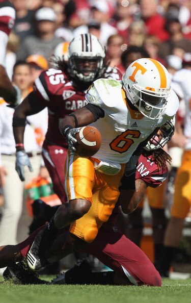 COLUMBIA, SC - OCTOBER 30:  Denarius Moore #6 of the Tennessee Volunteers is tackled by Melvin Ingram #6 of the South Carolina Gamecocks during their game at Williams-Brice Stadium on October 30, 2010 in Columbia, South Carolina.  (Photo by Streeter Lecka