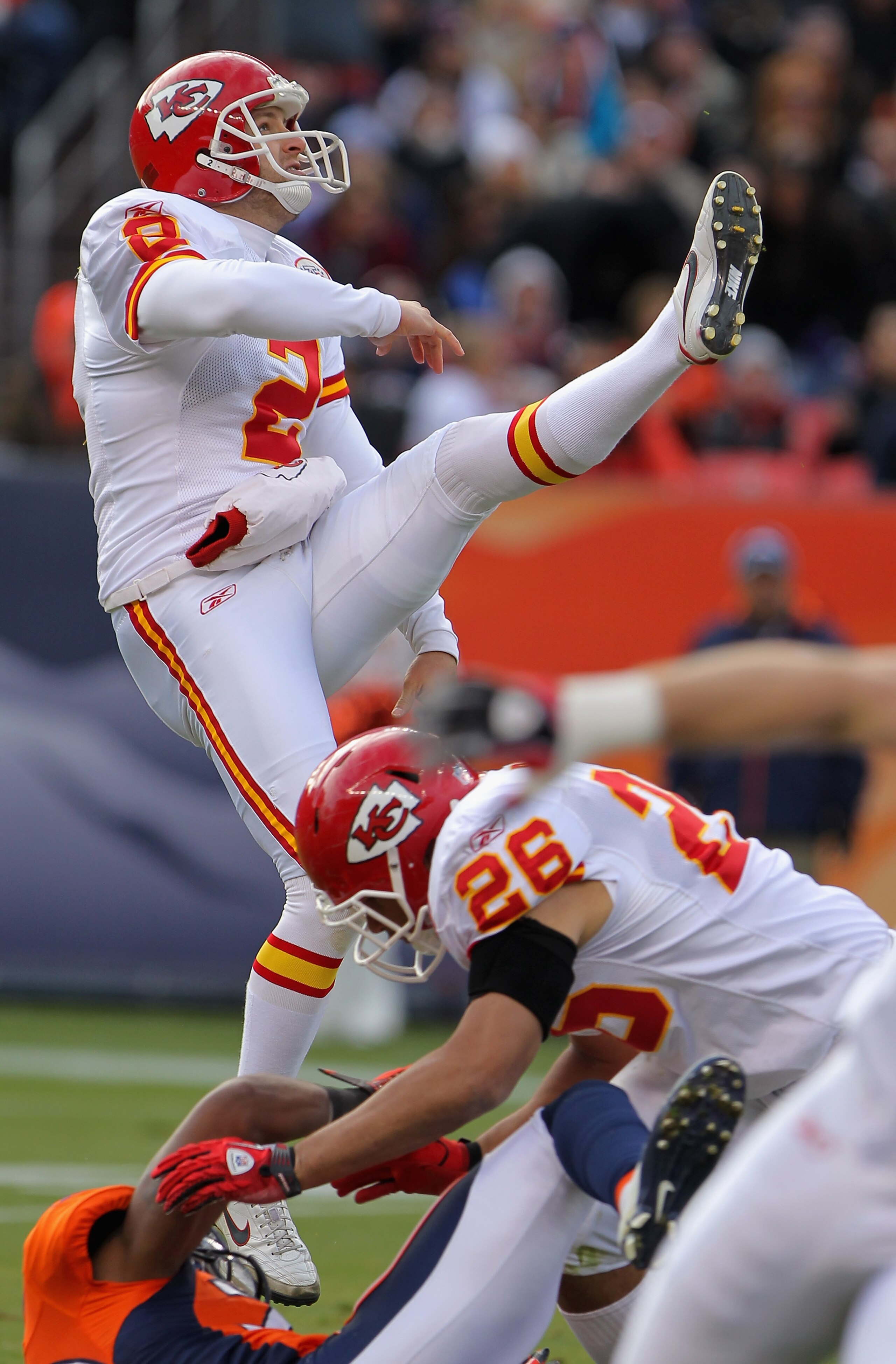 DENVER - NOVEMBER 14:  Punter Dustin Colquitt #2 of the Kansas City Chiefs follows through on a punt against the Denver Bronco at INVESCO Field at Mile High on November 14, 2010 in Denver, Colorado. The Broncos defeated the Chiefs 49-29.  (Photo by Doug P