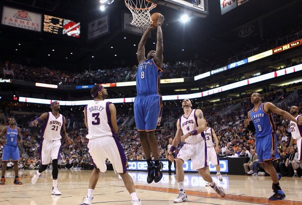 PHOENIX, AZ - MARCH 30:  Nazr Mohammed #8 of the Oklahoma City Thunder slam dunks the ball against the Phoenix Suns during the NBA game at US Airways Center on March 30, 2011 in Phoenix, Arizona.  NOTE TO USER: User expressly acknowledges and agrees that,