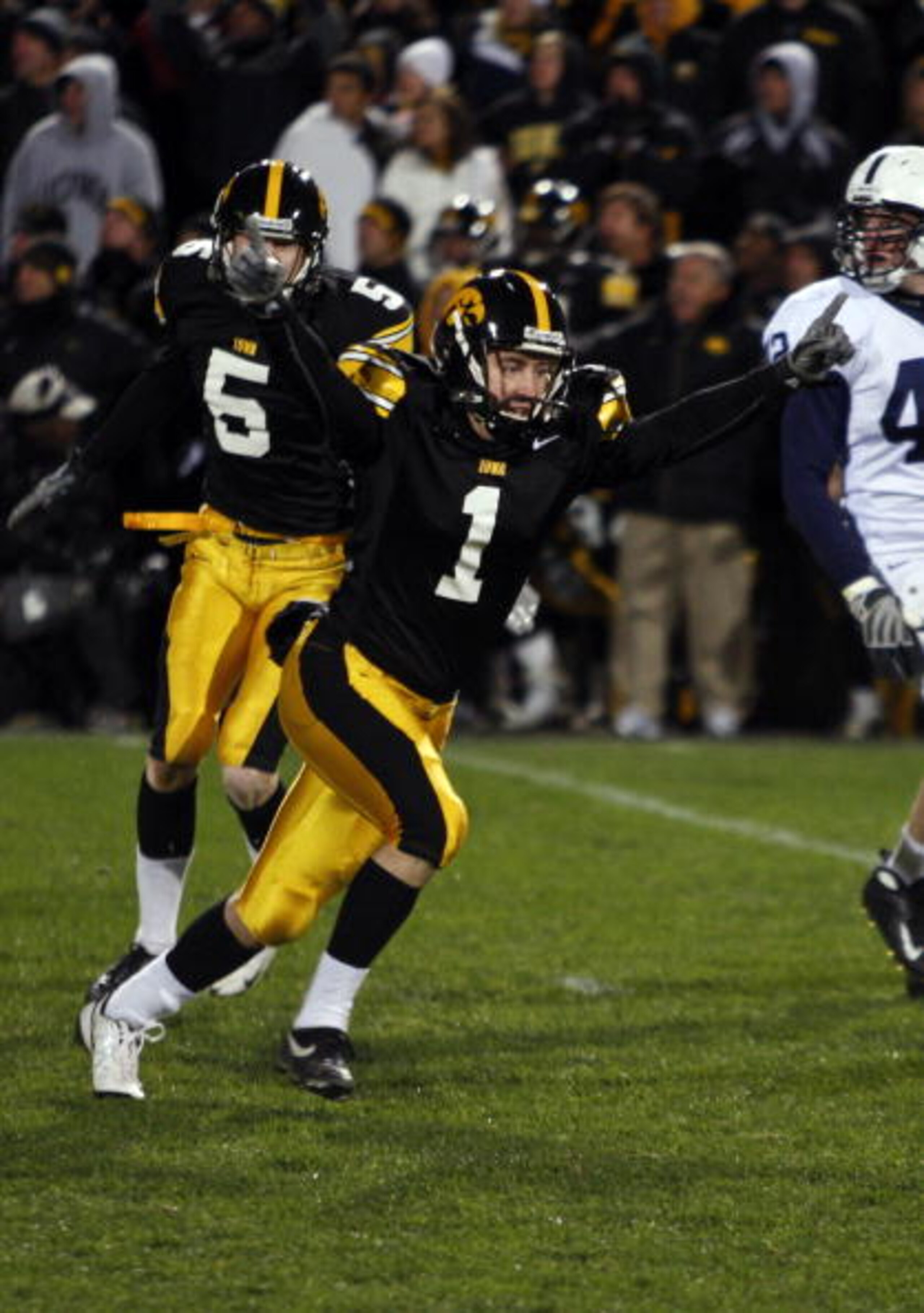 IOWA CITY, IA - NOVEMBER 8:  Iowa Kicker Daniel Murray #1 celebrates with teammate Ryan Donahue #5 after kicking the game winning field goal defeating Penn State Nittany Lions with six seconds left on the clock at Kinnick Stadium on November 8, 2008 in Io