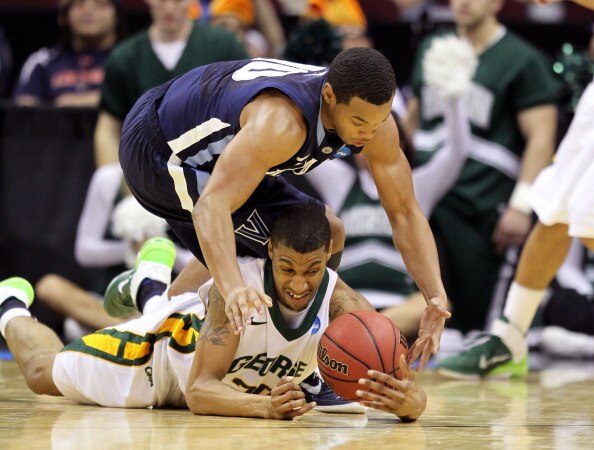 CLEVELAND, OH - MARCH 18:  Cam Long #20 of the George Mason Patriots and Corey Fisher #10 of the Villanova Wildcats fight for a loose ball during the second round of the 2011 NCAA men's basketball tournament at Quicken Loans Arena on March 18, 2011 in Cle