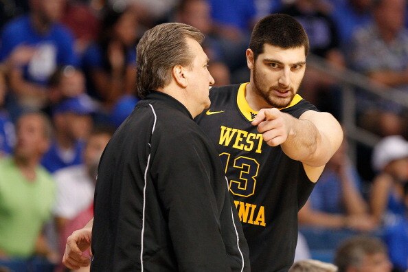 TAMPA, FL - MARCH 19:  (L-R) Head coach Bob Huggins of the West Virginia talks with Deniz Kilicli #13 against the Kentucky Wildcats during the third round of the 2011 NCAA men's basketball tournament at St. Pete Times Forum on March 19, 2011 in Tampa, Flo