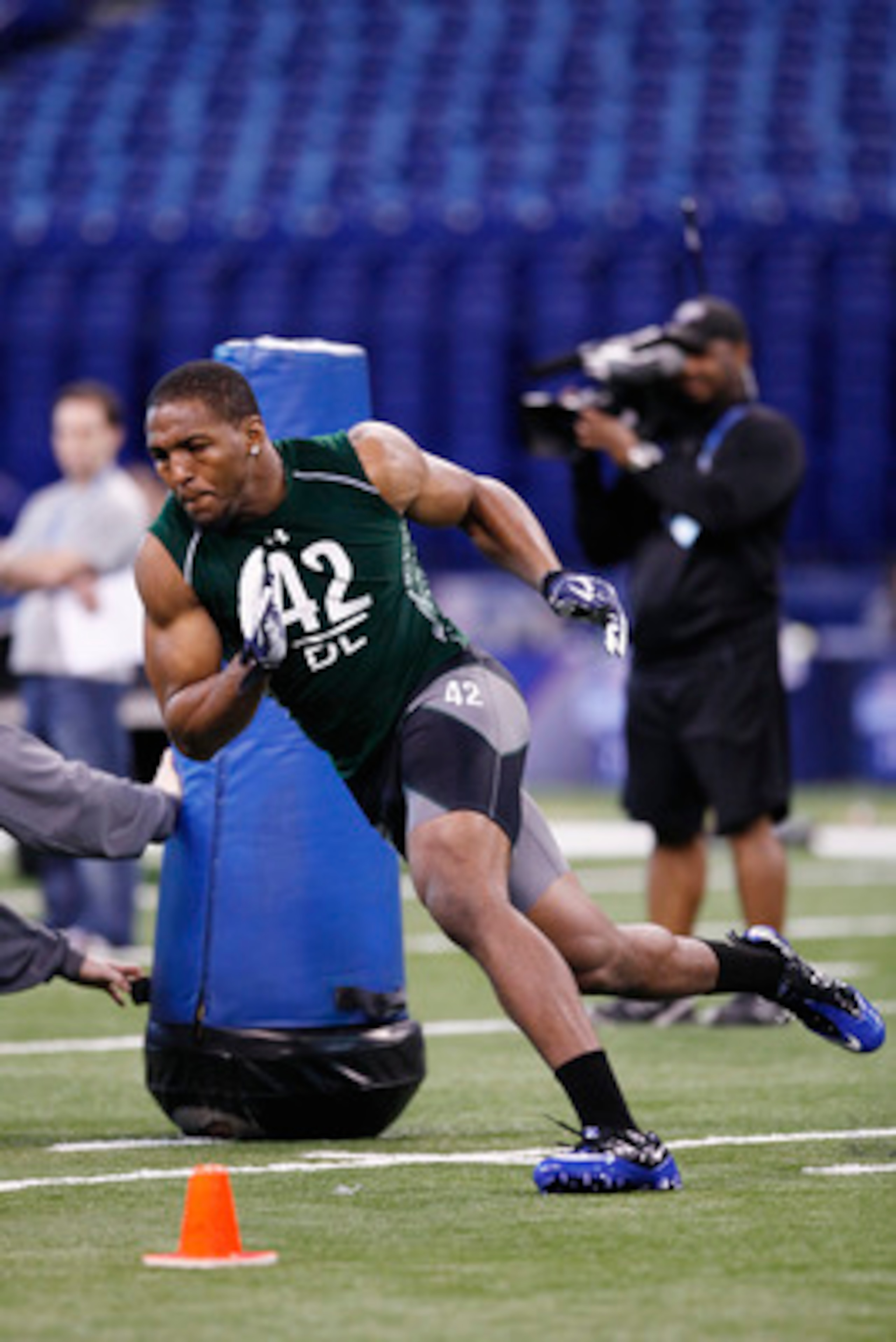 INDIANAPOLIS, IN - FEBRUARY 28:  Defensive lineman Robert Quinn of North Carolina runs through a drill during the 2011 NFL Scouting Combine at Lucas Oil Stadium on February 28, 2011 in Indianapolis, Indiana. (Photo by Joe Robbins/Getty Images)