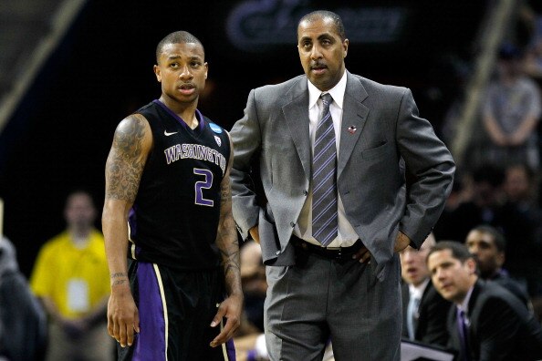 CHARLOTTE, NC - MARCH 20:  Isaiah Thomas #2 talks with head coach Lorenzo Romar of the Washington Huskies while taking on the North Carolina Tar Heels during the third round of the 2011 NCAA men's basketball tournament at Time Warner Cable Arena on March 