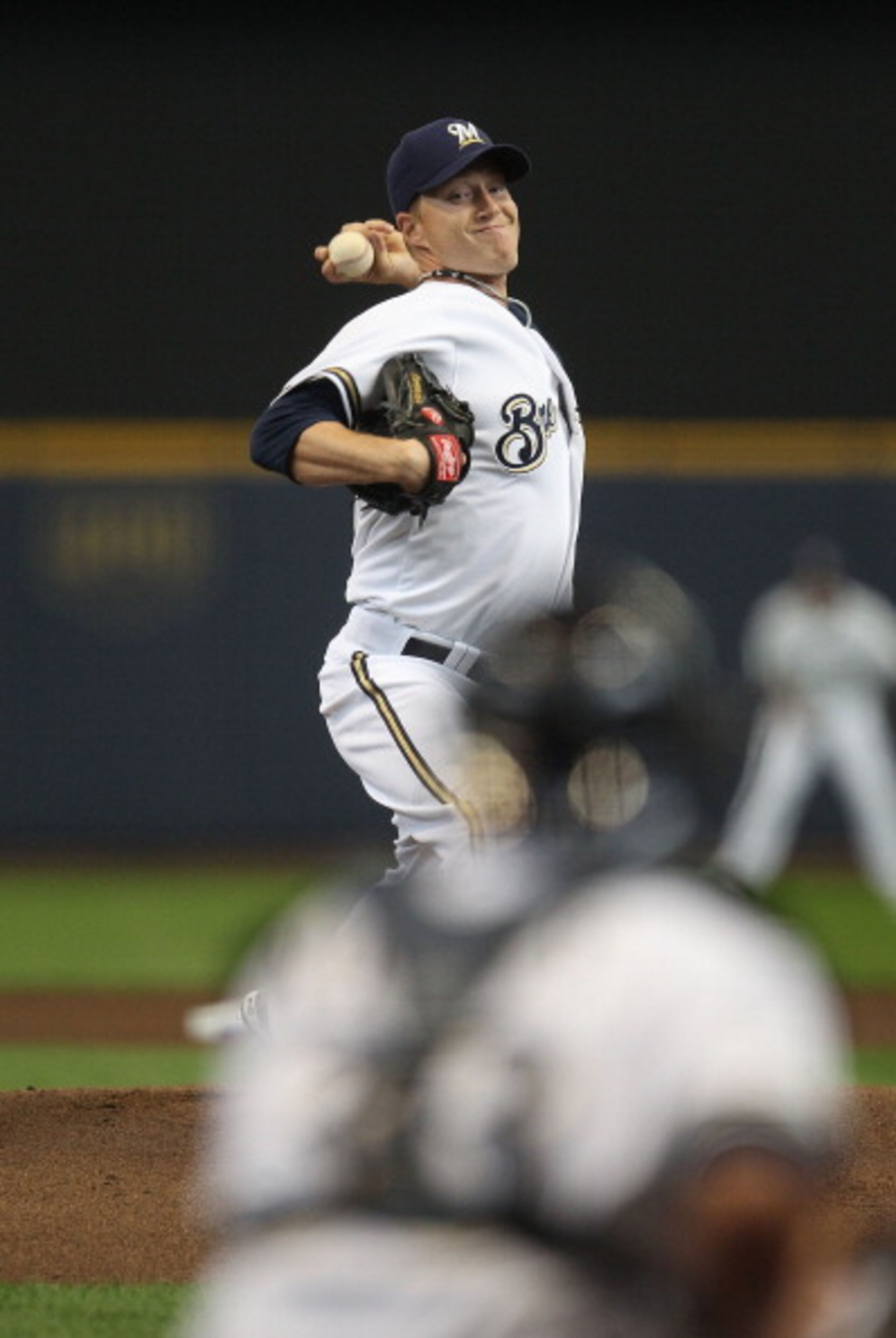 MILWAUKEE, WI - APRIL 04: Starting pitcher Chris Narveson #38 of the Milwaukee Brewers delivers the ball against the Atlanta Braves during the home opener at Miller Park on April 4, 2011 in Milwaukee, Wisconsin. The Braves defeated the Brewers 2-1. (Phot MILWAUKEE, WI - APRIL 04: Starting pitcher Chris Narveson #38 of the Milwaukee Brewers delivers the ball against the Atlanta Braves during the home opener at Miller Park on April 4, 2011 in Milwaukee, Wisconsin. The Braves defeated the Brewers 2-1. (Phot
