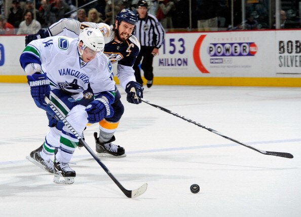 NASHVILLE, TN - MARCH 29:  Alexandre Burrows #14 of the Vancouver Canucks outskates Shea Weber #6 of the Nashville Predators to score a goal on the breakaway on March 29, 2011 at the Bridgestone Arena in Nashville, Tennessee.  (Photo by Frederick Breedon/