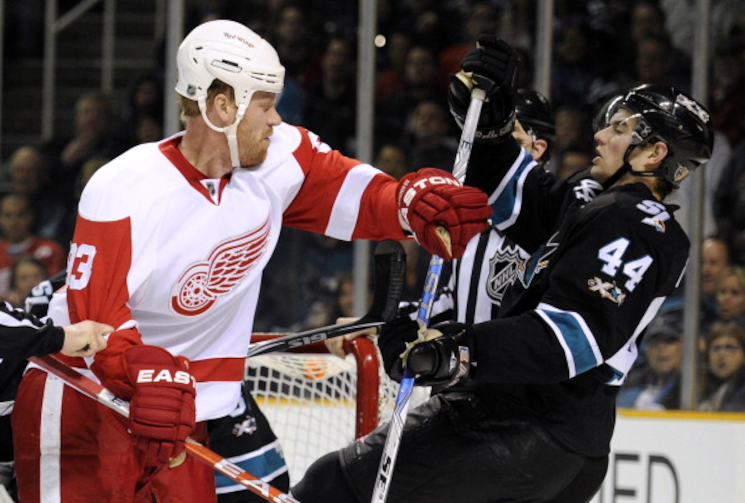 SAN JOSE, CA - MARCH 3: Johan Franzen #93 of the Detroit Red Wings takes a swing at Marc-Edouard Vlasic #44 of the San Jose Sharks and both get a four-minute roughing penalty in the first period of an NHL hockey game at the HP Pavilion on March 3, 2011 in SAN JOSE, CA - MARCH 3: Johan Franzen #93 of the Detroit Red Wings takes a swing at Marc-Edouard Vlasic #44 of the San Jose Sharks and both get a four-minute roughing penalty in the first period of an NHL hockey game at the HP Pavilion on March 3, 2011 in