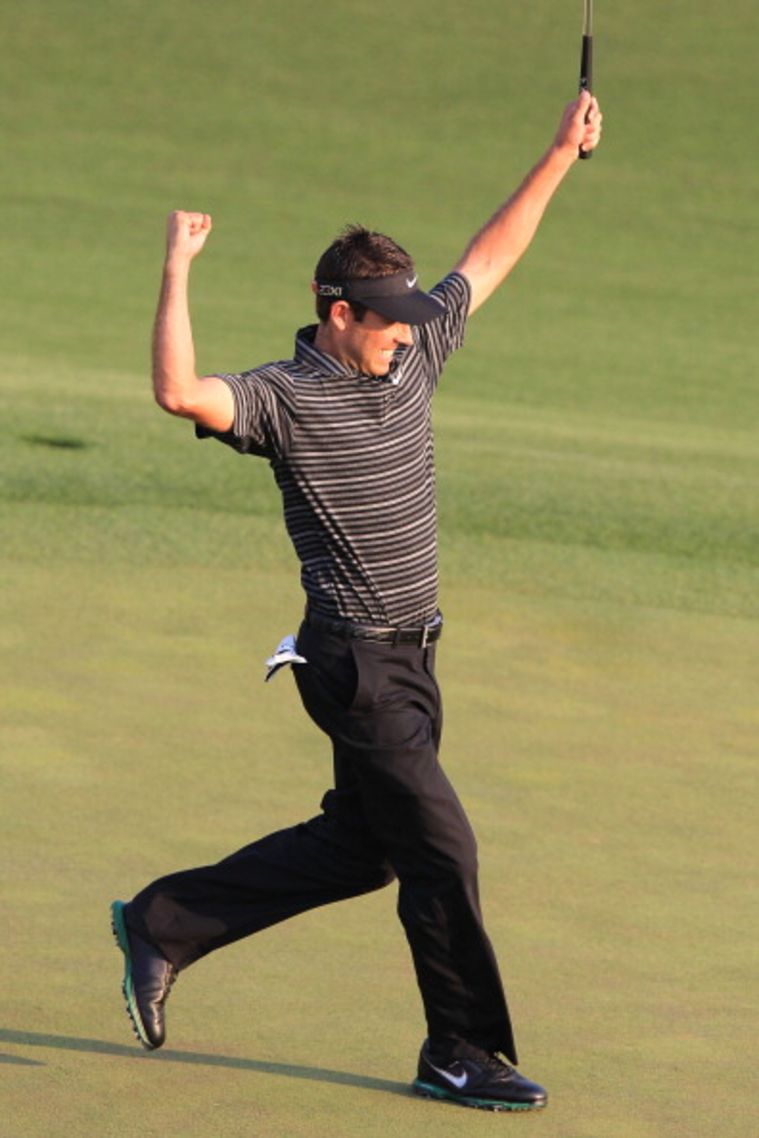 AUGUSTA, GA - APRIL 10:  Charl Schwartzel of South Africa celebrates his two-stroke victory on the 18th green during the final round of the 2011 Masters Tournament at Augusta National Golf Club on April 10, 2011 in Augusta, Georgia.  (Photo by David Canno