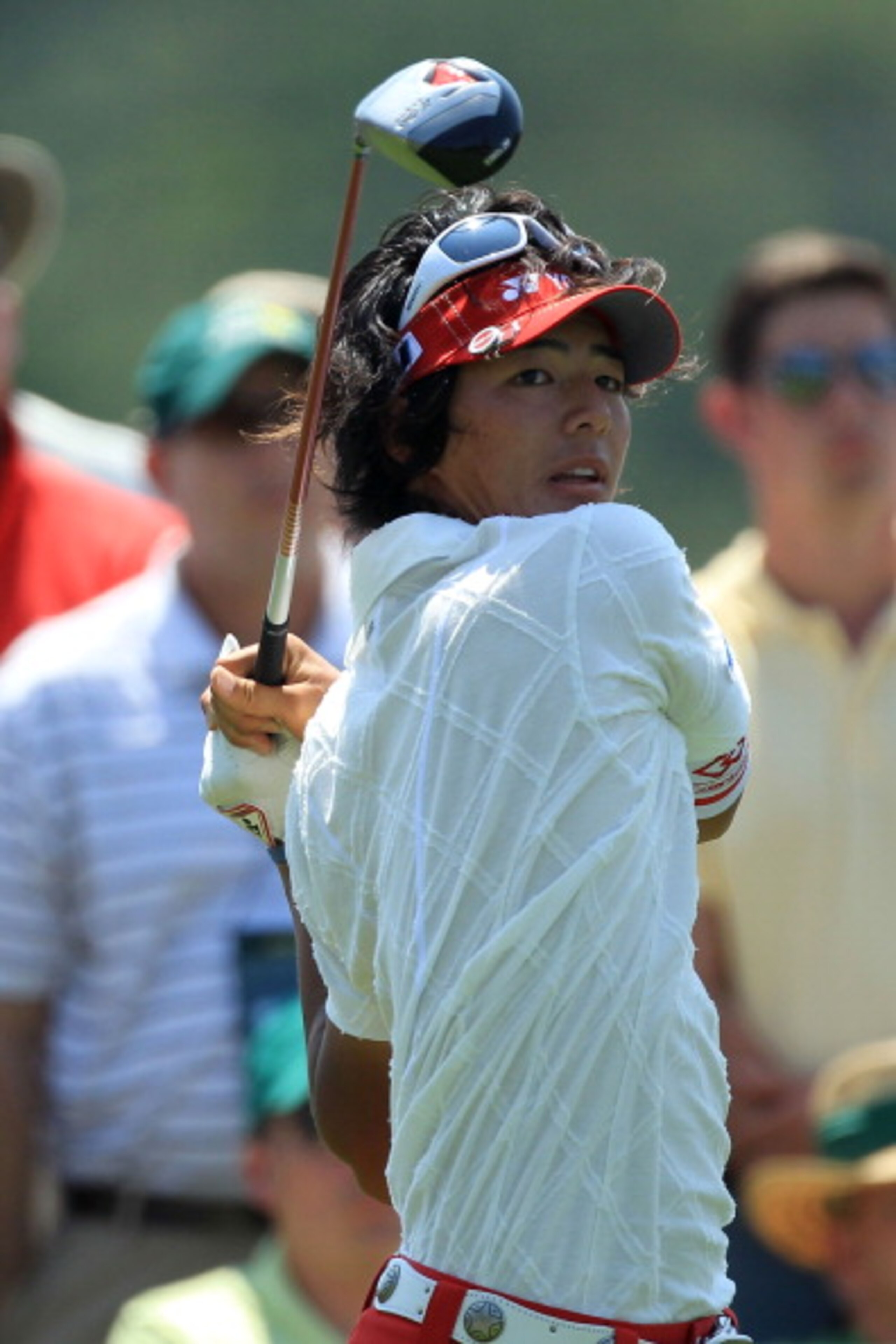 AUGUSTA, GA - APRIL 10:  Ryo Ishikawa of Japan watches his tee shot on the eighth hole during the final round of the 2011 Masters Tournament on April 10, 2011 in Augusta, Georgia.  (Photo by David Cannon/Getty Images)