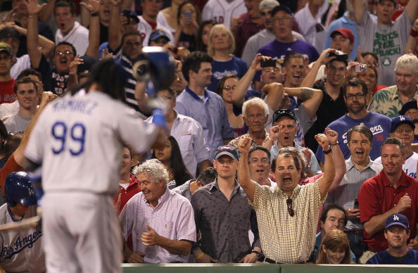 BOSTON - JUNE 18:  Red Sox fans cheer after Manny Ramirez #99 of the Los Angeles Dodgers struck out looking in the ninth inning with two men on base against the Boston Red Sox at Fenway Park on June 18, 2010 in Boston, Massachusetts. (Photo by Jim Rogash/