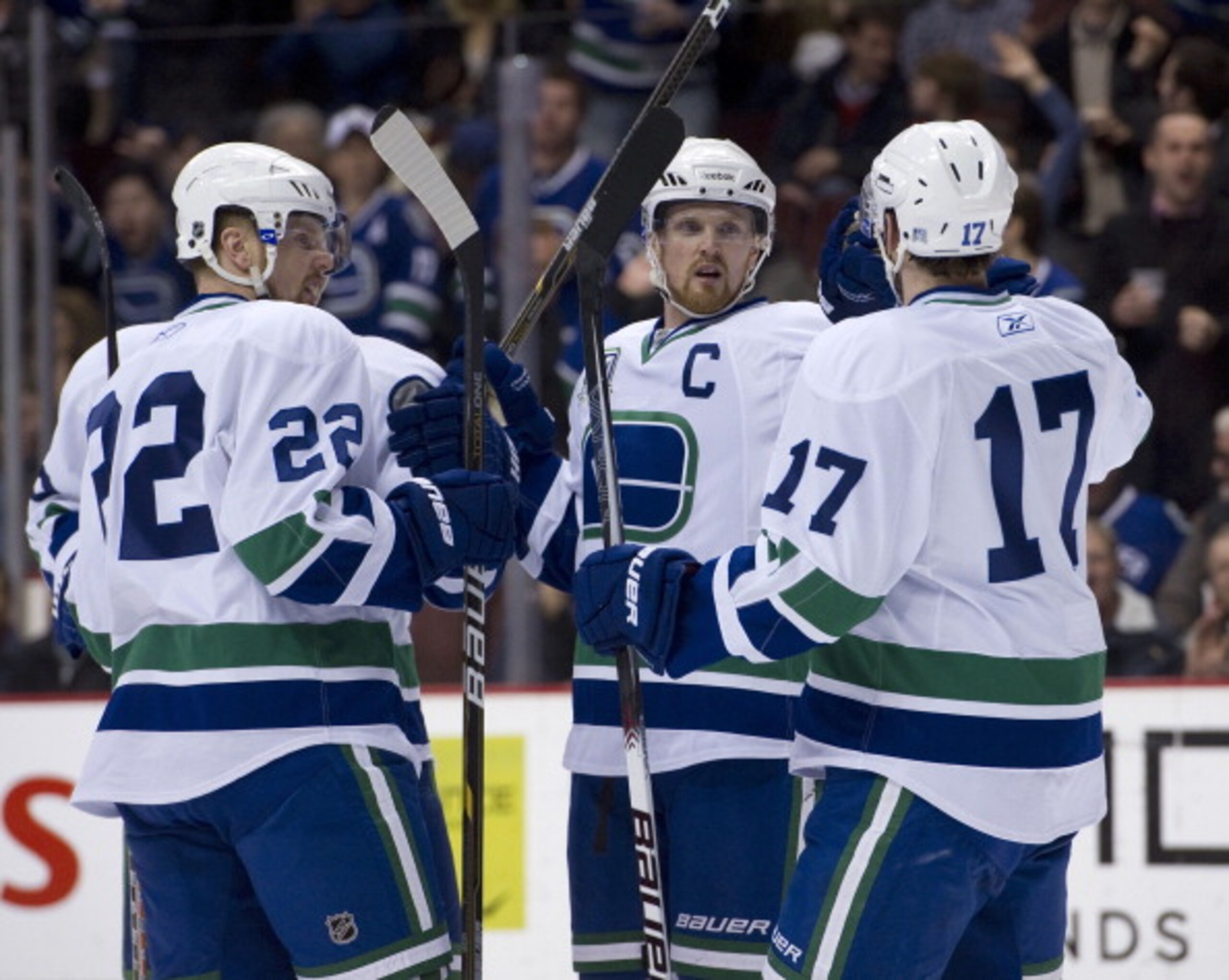 VANCOUVER, CANADA - FEBRUARY 22: Henrik Sedin #33 celebrates with Daniel Sedin #22 and Ryan Kesler #17 of the Vancouver Canucks after scoring a power play goal against the Montreal Canadiens during the second period in NHL action on February 22, 2011 at R VANCOUVER, CANADA - FEBRUARY 22: Henrik Sedin #33 celebrates with Daniel Sedin #22 and Ryan Kesler #17 of the Vancouver Canucks after scoring a power play goal against the Montreal Canadiens during the second period in NHL action on February 22, 2011 at R
