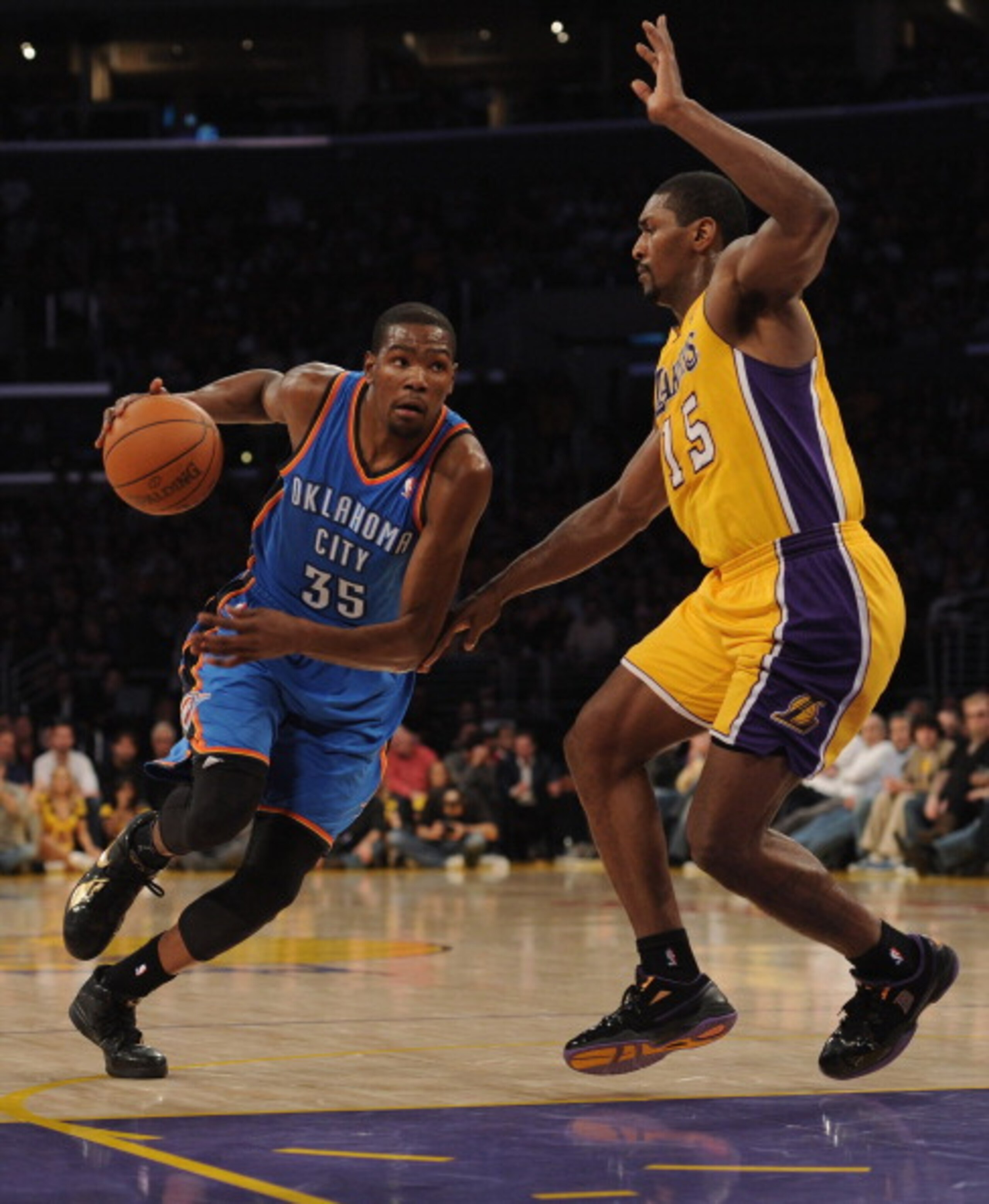 LOS ANGELES, CA - JANUARY 17: Kevin Durant #35 of the Oklahoma City Thunder dribbles to the basket around Ron Artest #15 of the Los Angeles Lakers at the Staples Center on January 17, 2011 in Los Angeles, California. NOTE TO USER: User expressly acknow LOS ANGELES, CA - JANUARY 17: Kevin Durant #35 of the Oklahoma City Thunder dribbles to the basket around Ron Artest #15 of the Los Angeles Lakers at the Staples Center on January 17, 2011 in Los Angeles, California. NOTE TO USER: User expressly acknow