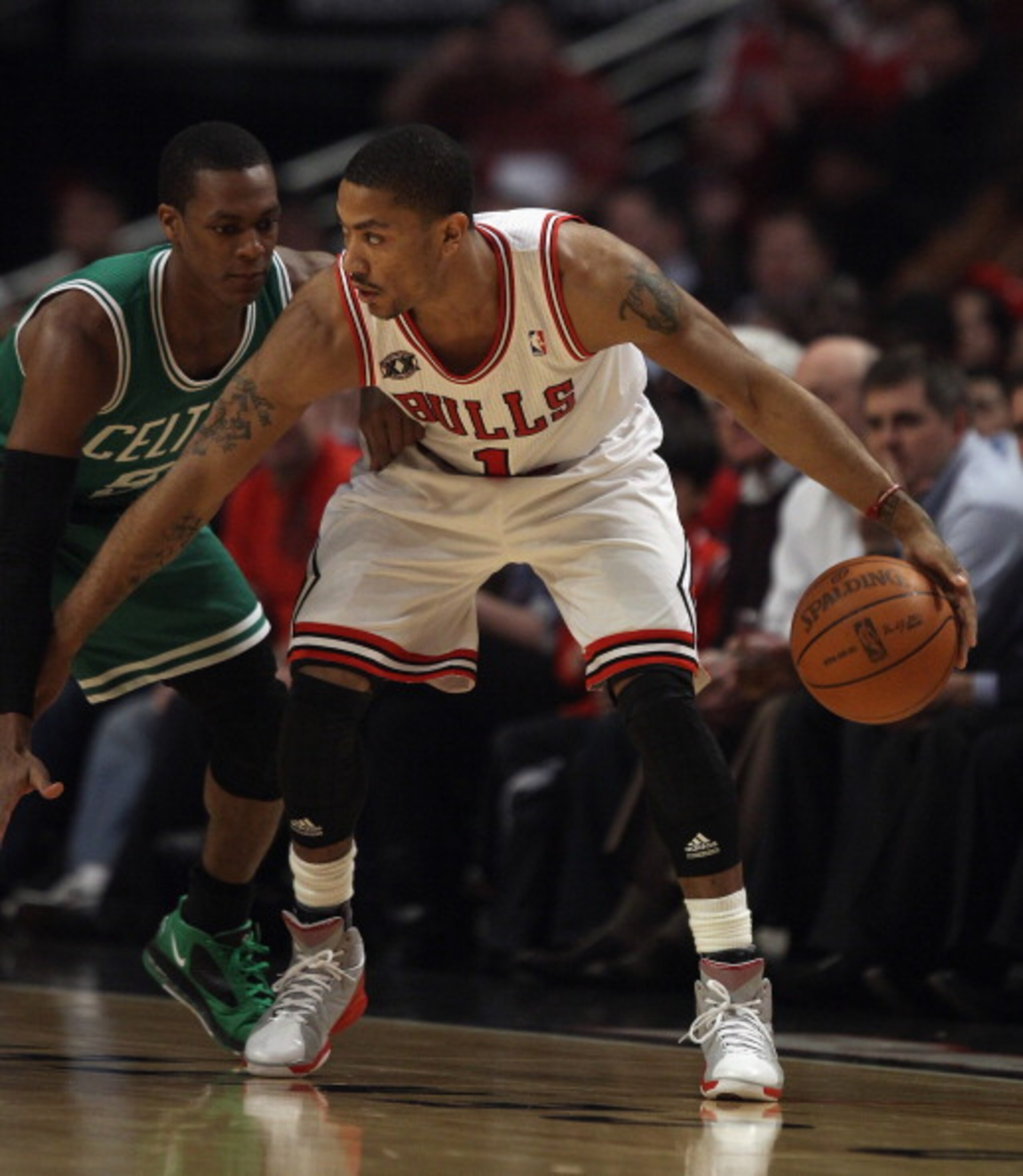 CHICAGO, IL - APRIL 07: Derrick Rose #1 of the Chicago Bulls moves against Rajon Rondo #9 of the Boston Celtics at United Center on April 7, 2011 in Chicago, Illinois. The Bulls defeated the Celtics 97-81. NOTE TO USER: User expressly acknowledges and agr CHICAGO, IL - APRIL 07: Derrick Rose #1 of the Chicago Bulls moves against Rajon Rondo #9 of the Boston Celtics at United Center on April 7, 2011 in Chicago, Illinois. The Bulls defeated the Celtics 97-81. NOTE TO USER: User expressly acknowledges and agr