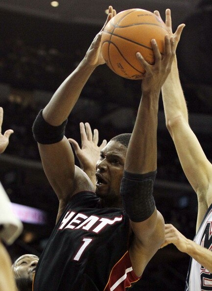 NEWARK, NJ - APRIL 03:  Chris Bosh #1 of the Miami Heat controls the ball against the New Jersey Nets at the Prudential Center on April 3, 2011 in Newark, New Jersey.NOTE TO USER: User expressly acknowledges and agrees that, by downloading and/or using th