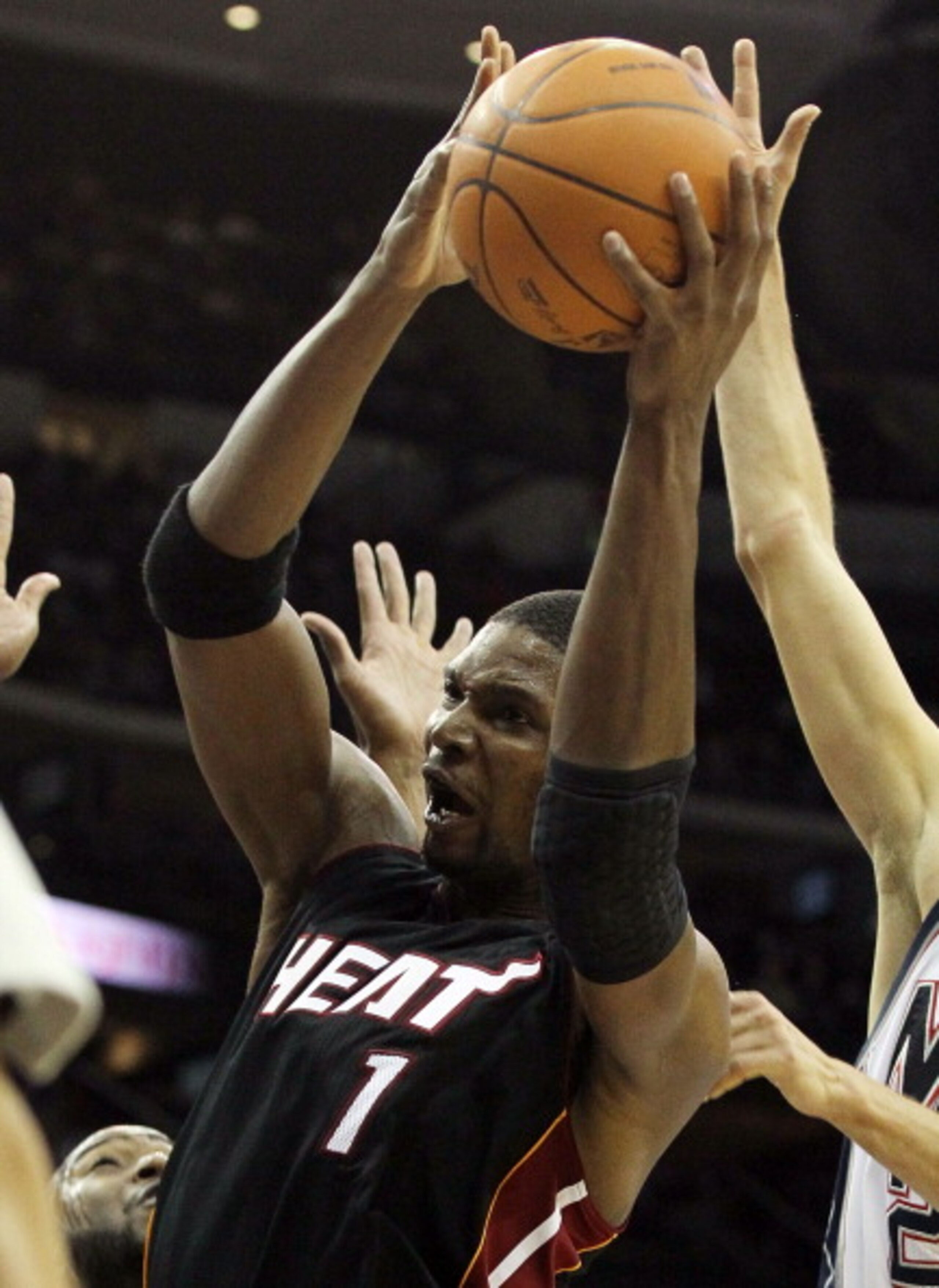 NEWARK, NJ - APRIL 03: Chris Bosh #1 of the Miami Heat controls the ball against the New Jersey Nets at the Prudential Center on April 3, 2011 in Newark, New Jersey.NOTE TO USER: User expressly acknowledges and agrees that, by downloading and/or using th NEWARK, NJ - APRIL 03: Chris Bosh #1 of the Miami Heat controls the ball against the New Jersey Nets at the Prudential Center on April 3, 2011 in Newark, New Jersey.NOTE TO USER: User expressly acknowledges and agrees that, by downloading and/or using th