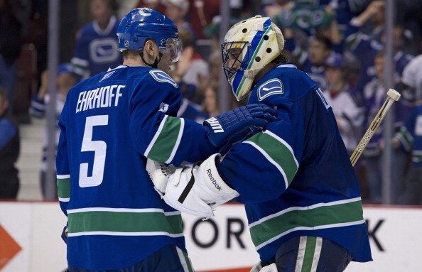 VANCOUVER, CANADA - MARCH 31: Goalie Roberto Luongo #1 of the Vancouver Canucks is congratulated by Christian Ehrhoff #5 after defeating the Los Angeles Kings in NHL action on March 31, 2011 at Rogers Arena in Vancouver, BC, Canada.  (Photo by Rich Lam/Ge