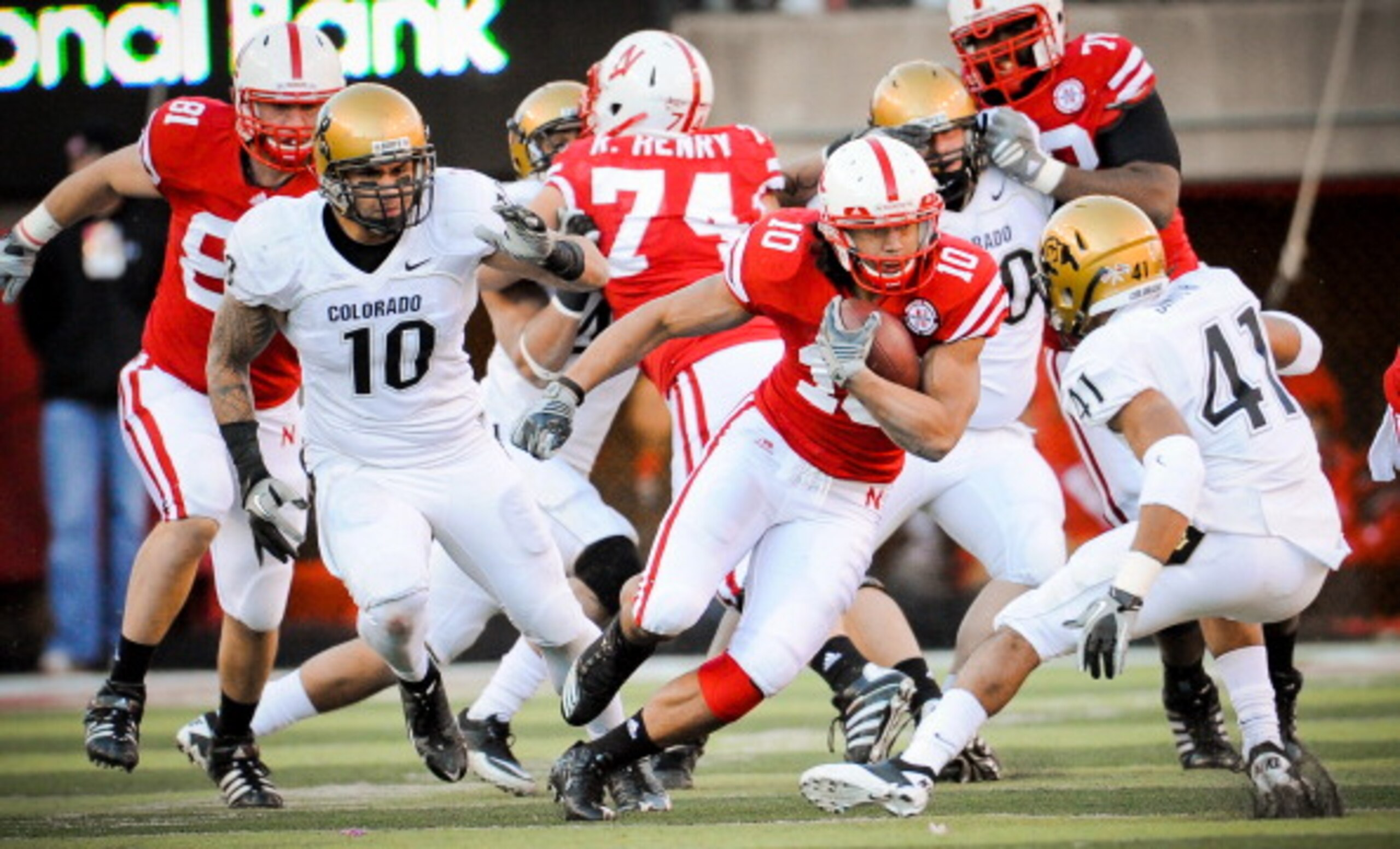 LINCOLN, NE - NOVEMBER 26: Roy Helu Jr. #10 of the Nebraska Cornhuskers weaves his way though the Colorado Buffalo defense during their game at Memorial Stadium on November 26, 2010 in Lincoln, Nebraska. Nebraska defeated Colorado 45-17 (Photo by Eric Fra