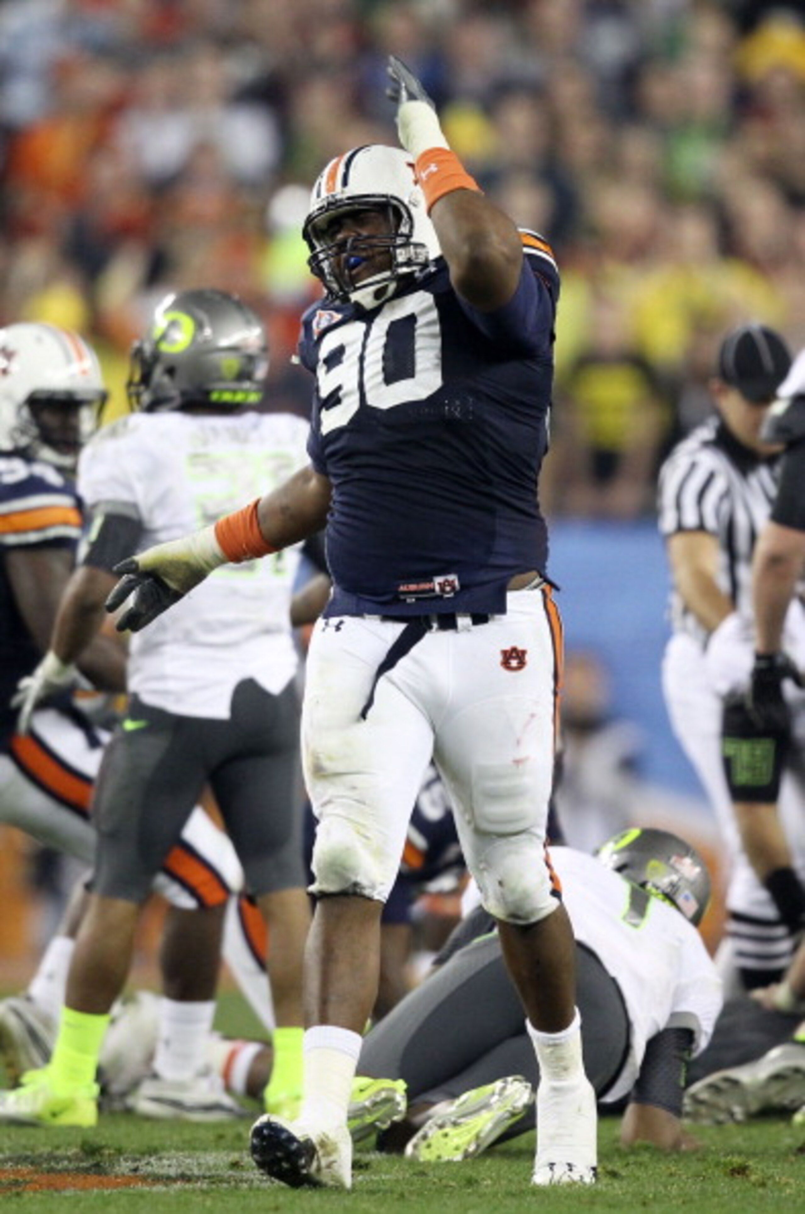 GLENDALE, AZ - JANUARY 10:  Nick Fairley #90 of the Auburn Tigers reacts during their Tostitos BCS National Championship Game against the Oregon Ducks at University of Phoenix Stadium on January 10, 2011 in Glendale, Arizona.  (Photo by Christian Petersen