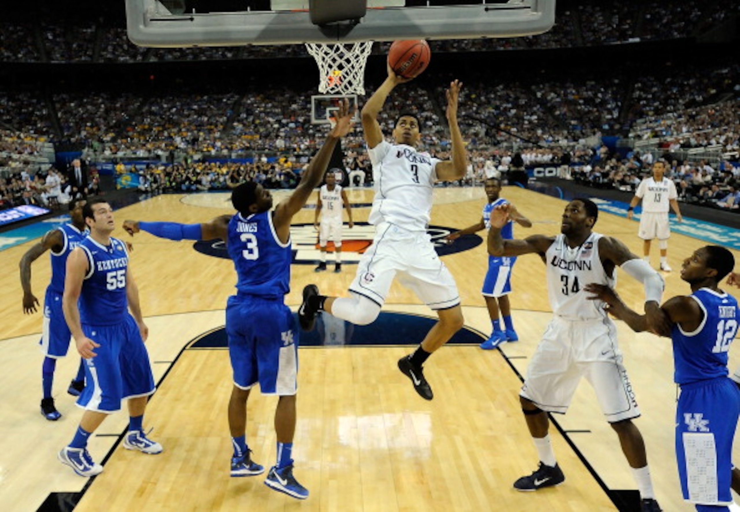 HOUSTON, TX - APRIL 02:  Jeremy Lamb #3 of the Connecticut Huskies goes to the hoop agianst Terrence Jones #3 of the Kentucky Wildcats during the National Semifinal game of the 2011 NCAA Division I Men's Basketball Championship at Reliant Stadium on April