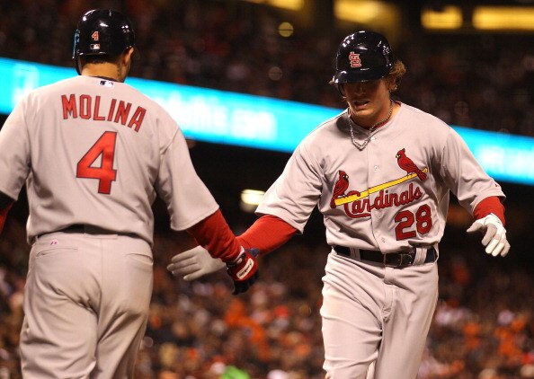 SAN FRANCISCO, CA - APRIL 09:  Colby Rasmus #28 of the St. Louis Cardinals celebrates with Yadier Molina #4 after hitting a home run against the San Francisco Giants at AT&T Park on April 9, 2011 in San Francisco, California.  (Photo by Jed Jacobsohn/Gett