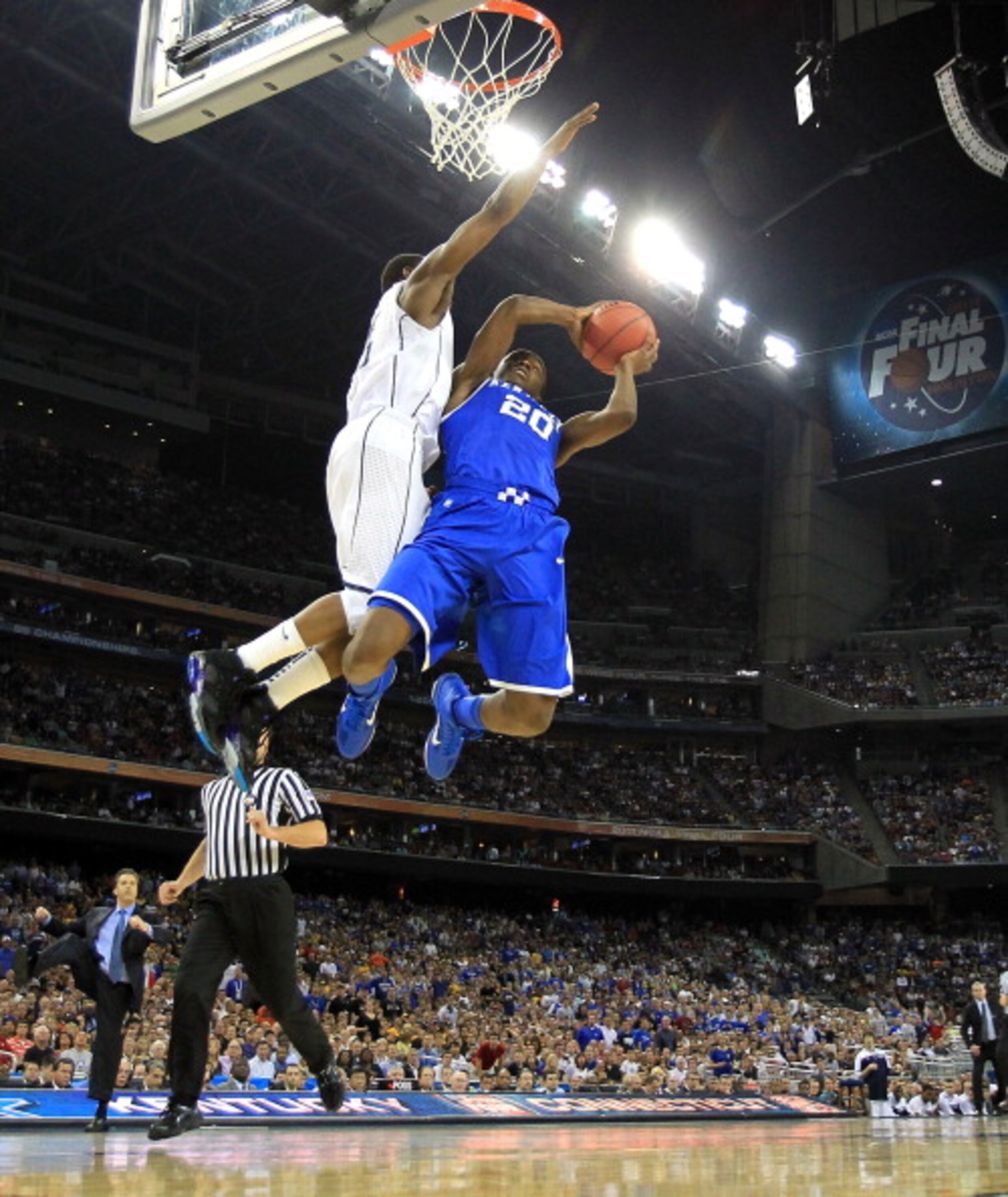 HOUSTON, TX - APRIL 02:  Doron Lamb #20 of the Kentucky Wildcats goes to the hoop against Kemba Walker #15 of the Connecticut Huskies during the National Semifinal game of the 2011 NCAA Division I Men's Basketball Championship at Reliant Stadium on April 