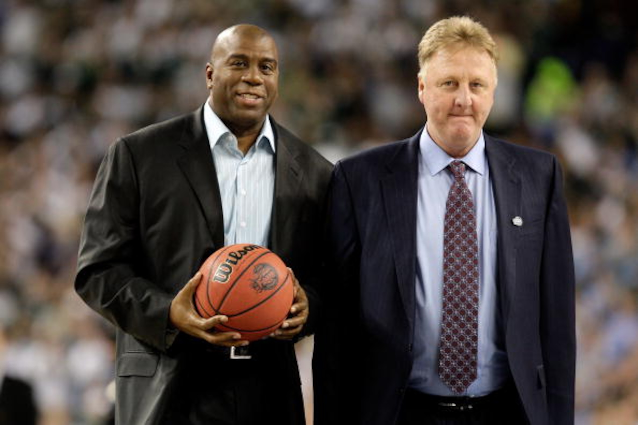 DETROIT - APRIL 06:  Larry Bird (R) and Earvin 'Magic' Johnson walk on the court to be honored for the 30th anniversary of their match up in 1979 NCAA Championship Game between Indiana State and Michigan State prior to the Michigan State Spartans playing 