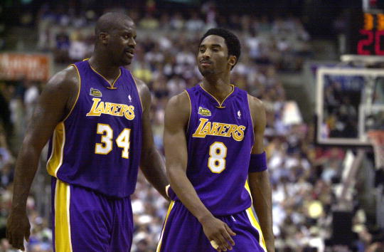 15 Jun 2001:  Shaquille O''Neal #34 and Kobe Bryant #8 of the Los Angeles Lakers walk to the bench during a time-out in game five of the NBA Finals against the Philadelphia 76ers at the First Union Center in Philadelphia, Pennsylvania.  The Lakers won 108
