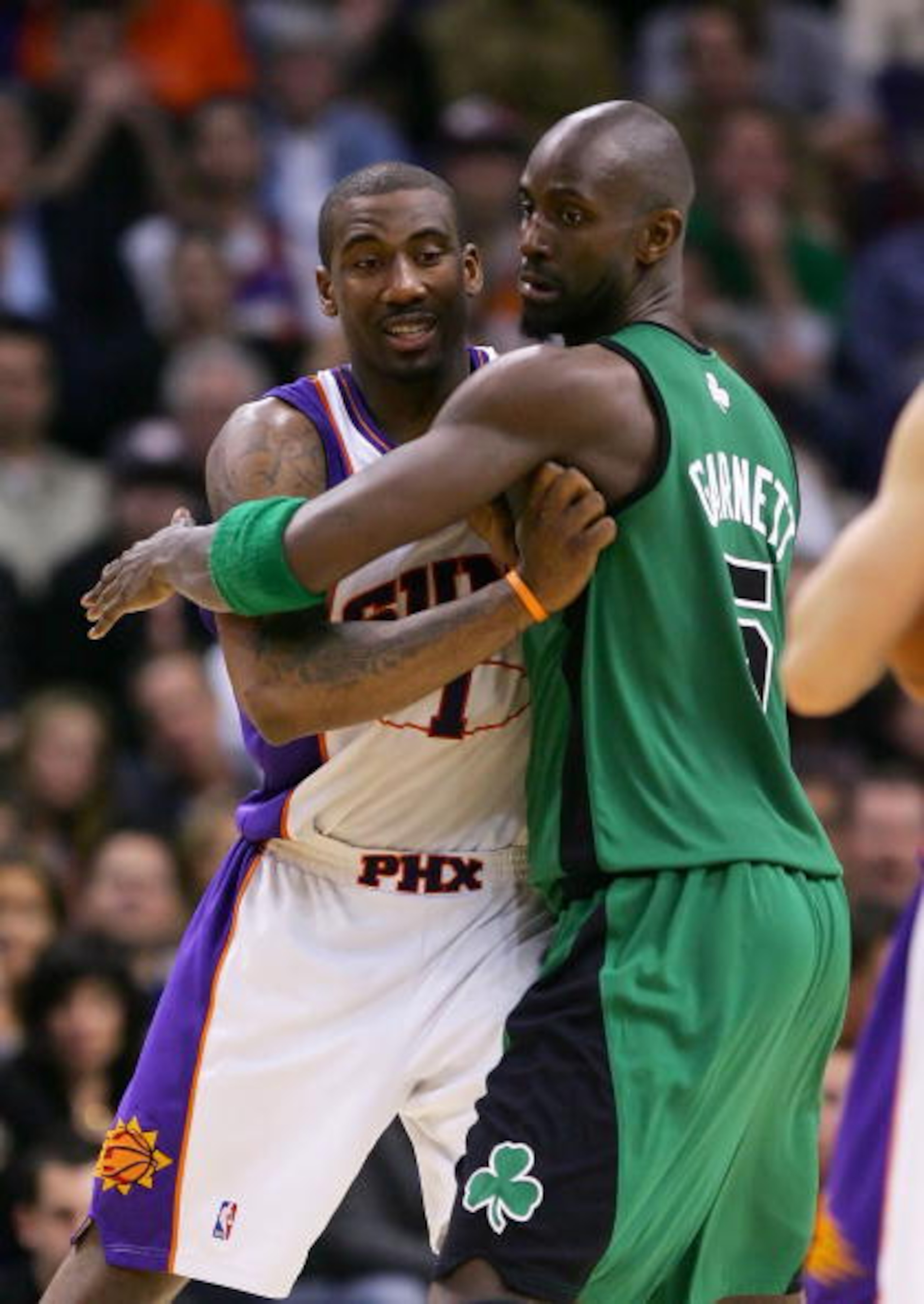 PHOENIX - FEBRUARY 22:  Amare Stoudemire #1 of the Phoenix Suns and Kevin Garnett #5 of the Boston Celtics battle for position at US Airways Center February 22, 2008 in Phoenix, Arizona.  NOTE TO USER: User expressly acknowledges and agrees that, by downl