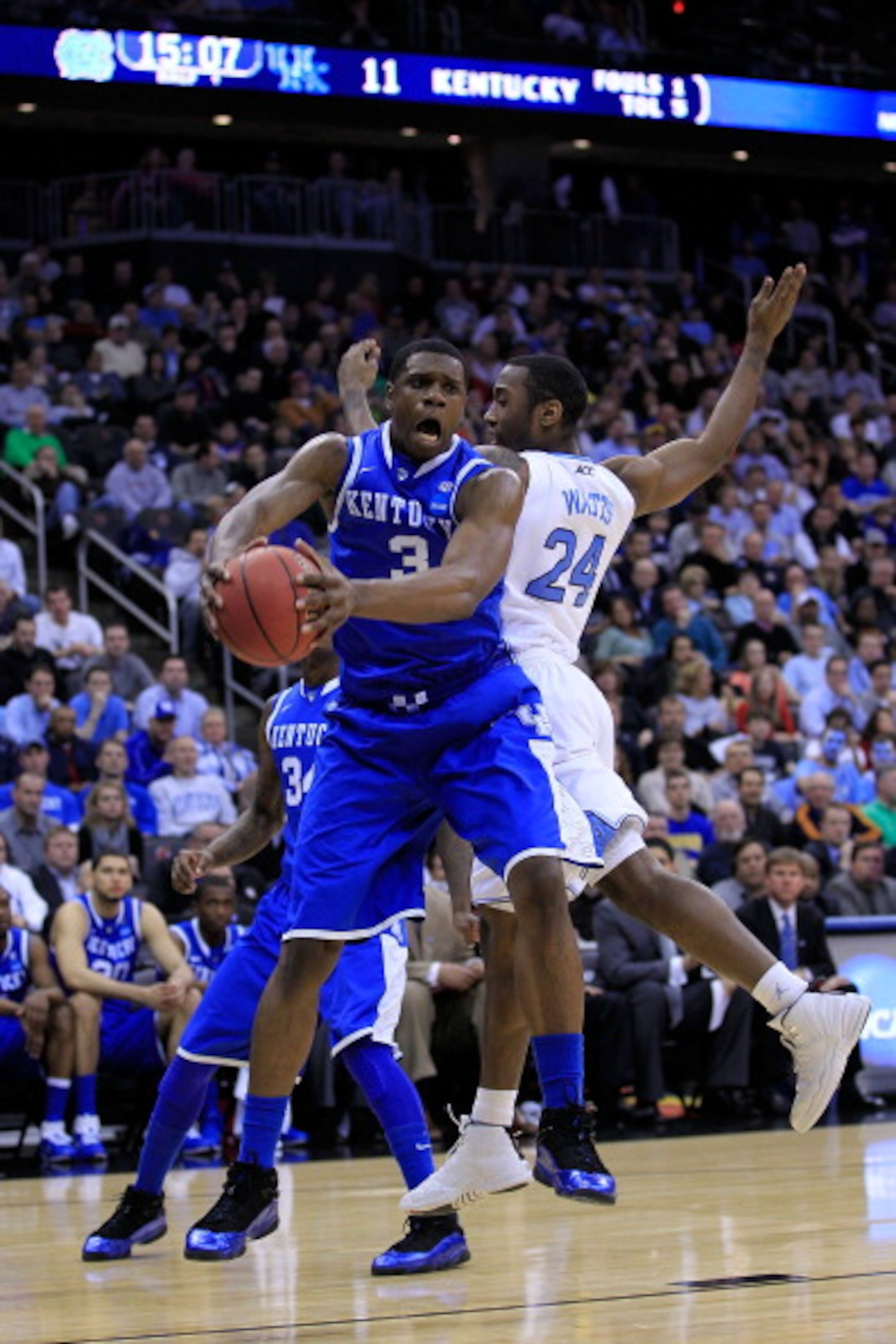 NEWARK, NJ - MARCH 27:  Terrence Jones #3 of the Kentucky Wildcats catches the ball against Justin Watts #24 of the North Carolina Tar Heels during the first half of the east regional final of the 2011 NCAA men's basketball tournament at Prudential Center