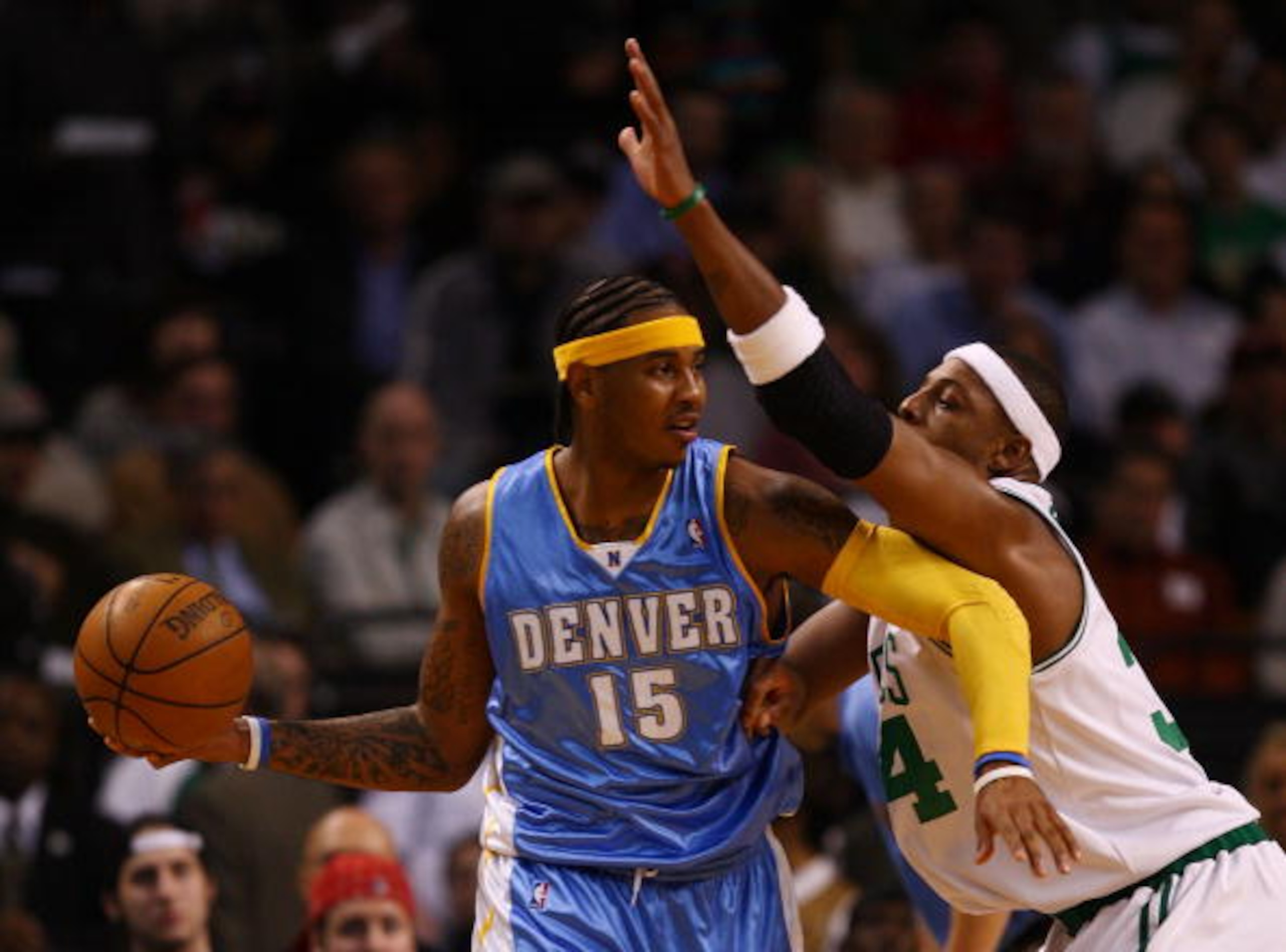 BOSTON - NOVEMBER 07:  Carmelo Anthony #15 of the Denver Nuggets looks to pass as Paul Pierce #34 of the Boston Celtics defends on November 7, 2007 at the TD Banknorth Garden in Boston, Massachusetts.  NOTE TO USER: User expressly acknowledges and agrees