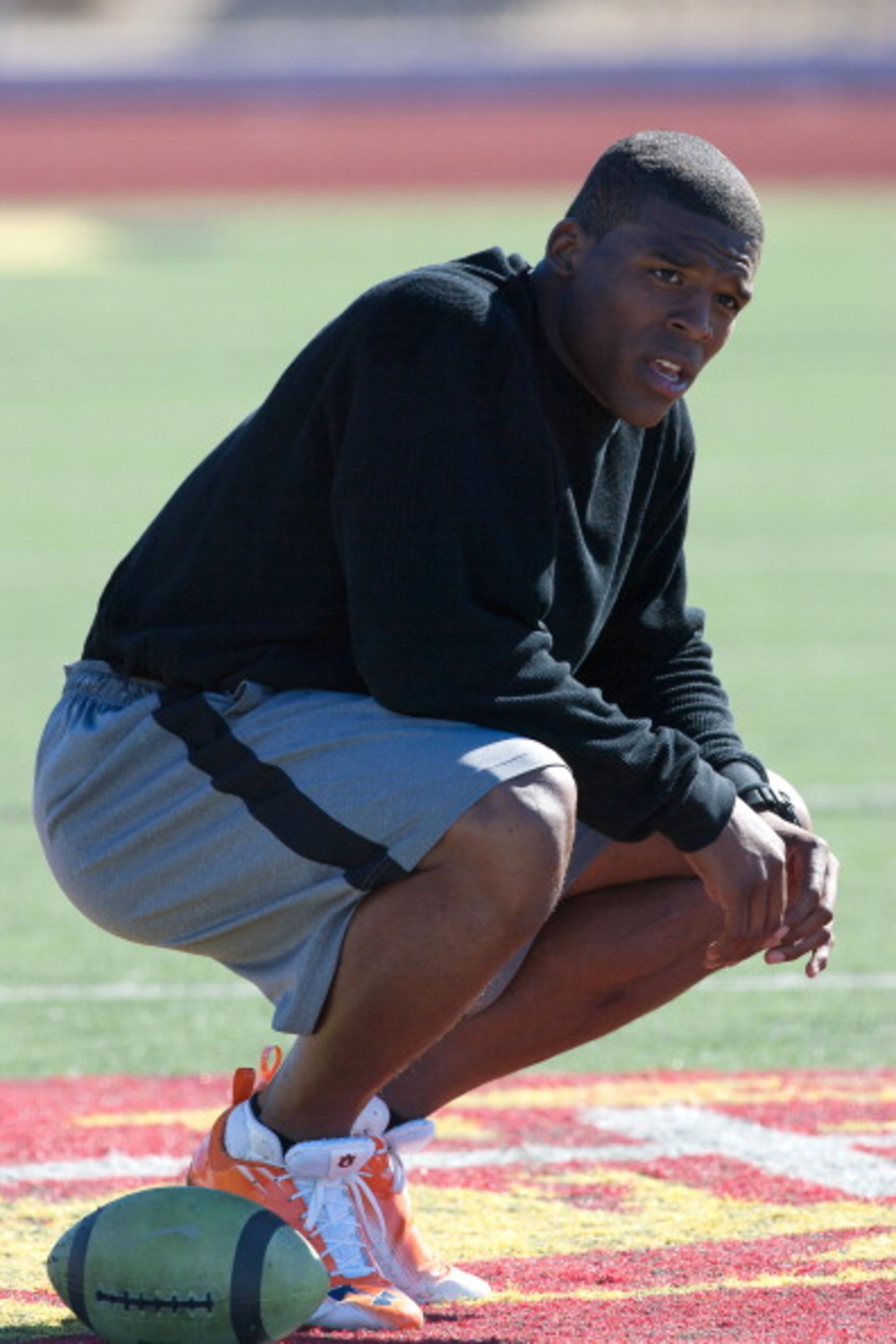 SAN DIEGO, CA - FEBRUARY 10: 2010 Heisman Trophy winning quarterback Cam Newton of Auburn pauses during his workout routine for the media at Cathedral High School's sports stadium on February 10, 2011 in San Diego, California. (Photo by Kent Horner/ Getty SAN DIEGO, CA - FEBRUARY 10: 2010 Heisman Trophy winning quarterback Cam Newton of Auburn pauses during his workout routine for the media at Cathedral High School's sports stadium on February 10, 2011 in San Diego, California. (Photo by Kent Horner/ Getty