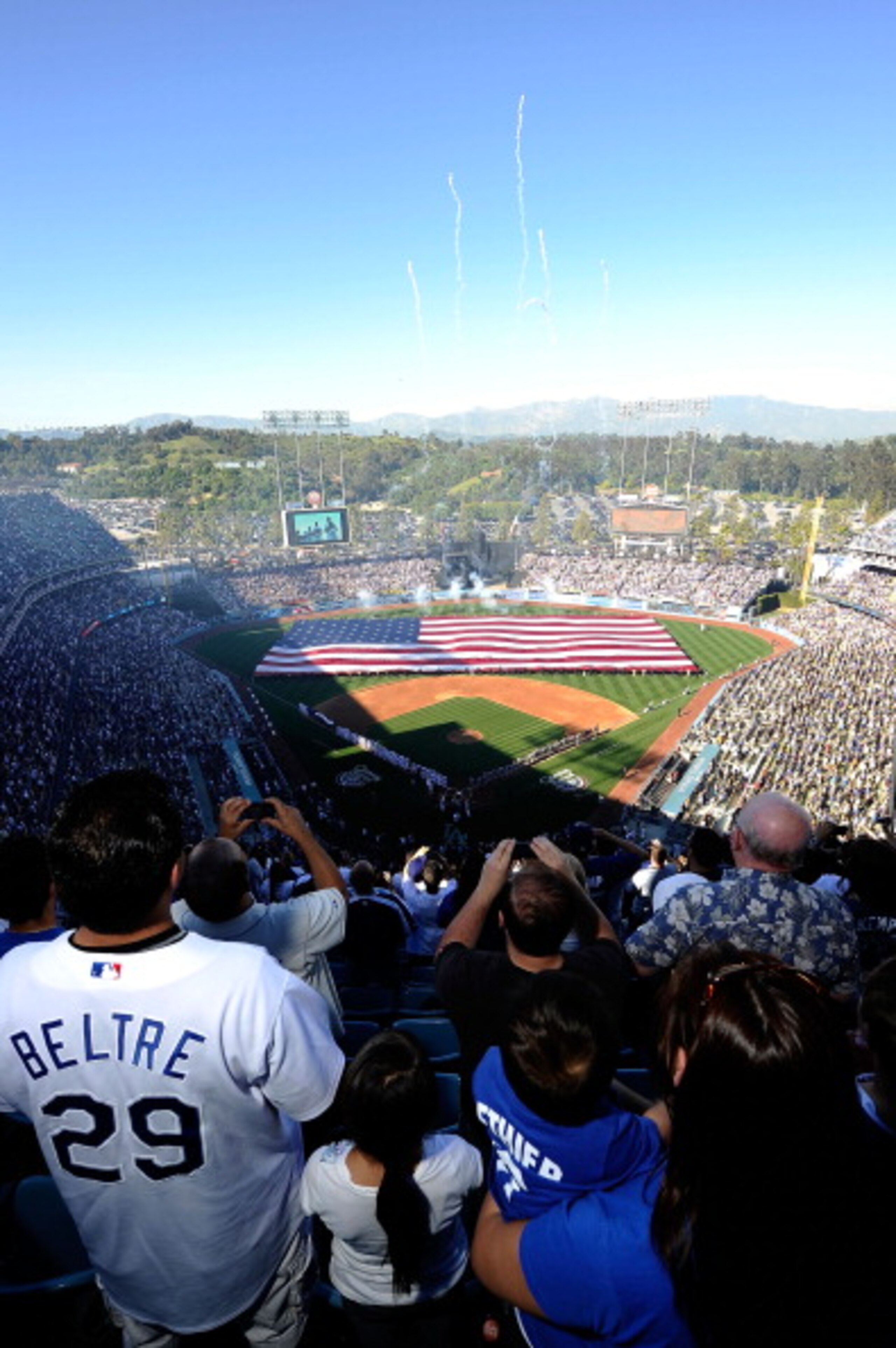 LOS ANGELES, CA - MARCH 31: A view of pregame ceremonies prior to the Los Angeles Dodgers playing the San Francisco Giants on Opening Day at Dodger Stadium on March 31, 2011 in Los Angeles, California. (Photo by Kevork Djansezian/Getty Images) LOS ANGELES, CA - MARCH 31: A view of pregame ceremonies prior to the Los Angeles Dodgers playing the San Francisco Giants on Opening Day at Dodger Stadium on March 31, 2011 in Los Angeles, California. (Photo by Kevork Djansezian/Getty Images)
