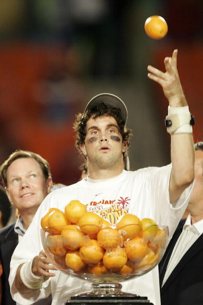 MIAMI - JANUARY 4:  Quarterback Matt Leinart #11 of the USC Trojans celebrates by throwing oranges after defeating the Oklahoma Sooners 55-19 to win the FedEx Orange Bowl 2005 National Championship on January 4, 2005 at Pro Player Stadium in Miami, Florid