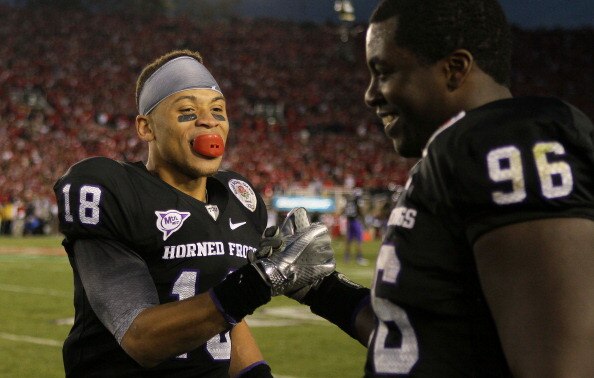 PASADENA, CA - JANUARY 01:  Cornerback Travaras Battle #18 of the TCU Horned Frogs celebrates with Wayne Daniels #96 in the final moments of their 21-19 win over the Wisconsin Badgers in the 97th Rose Bowl game on January 1, 2011 in Pasadena, California.