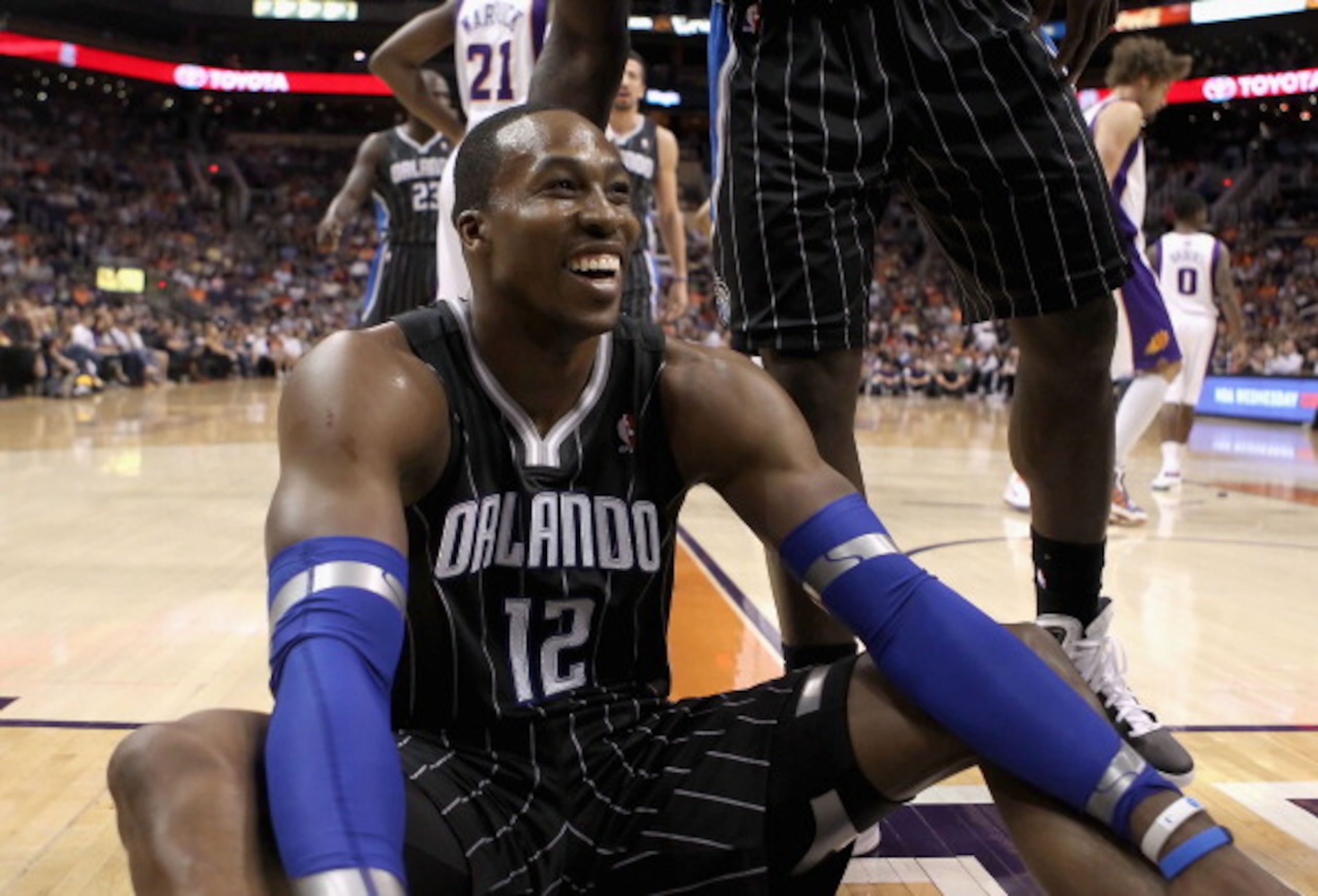 PHOENIX, AZ - MARCH 13:  Dwight Howard #12 of the Orlando Magic reacts to a foul call during the NBA game against the Phoenix Suns at US Airways Center on March 13, 2011 in Phoenix, Arizona. The Magic defeated the Suns 111-88. NOTE TO USER: User expressly