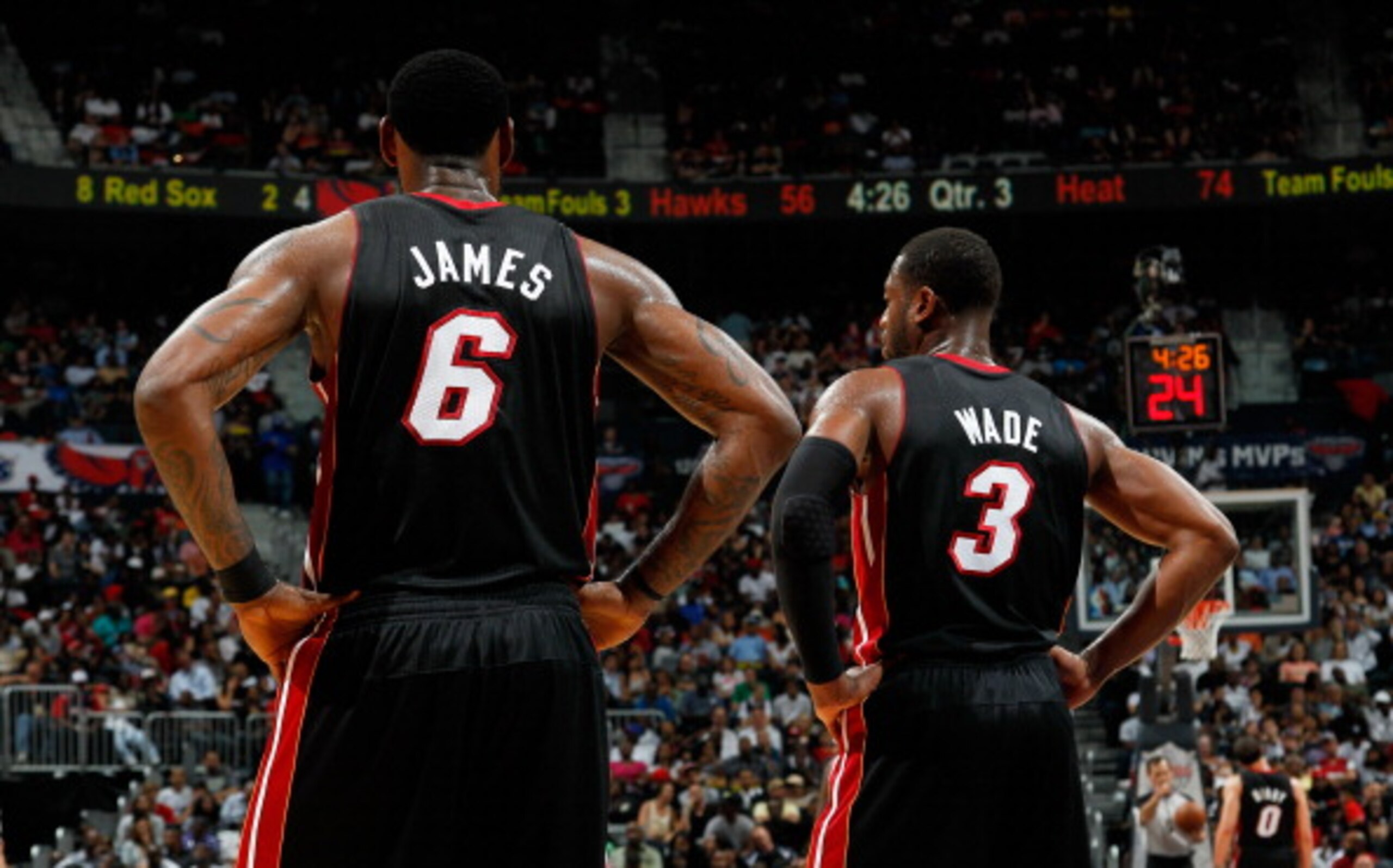 ATLANTA, GA - APRIL 11:  LeBron James #6 and Dwyane Wade #3 of the Miami Heat stand during a free throw against the Atlanta Hawks at Philips Arena on April 11, 2011 in Atlanta, Georgia.  NOTE TO USER: User expressly acknowledges and agrees that, by downlo
