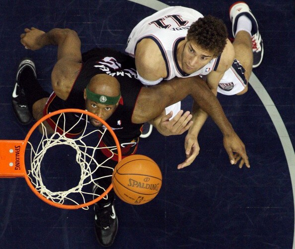 NEWARK, NJ - APRIL 03:  Eric Dampier #25 of the Miami Heat and Brook Lopez #11 of the New Jersey Nets battle for rebound at the Prudential Center on April 3, 2011 in Newark, New Jersey.The Heat defeated the Nets 108-94.NOTE TO USER: User expressly acknowl