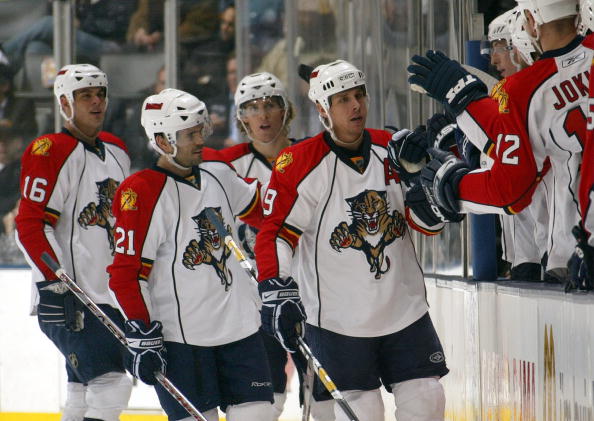 TORONTO - FEBRUARY 5:  (L-R) Nathan Horton #16, Cory Murphy #21, David Booth #10 and Stephen Weiss #9 of the Florida Panthers skate by their team bench to celebrate with teammates during a break in NHL game action against the Toronto Maple Leafs at the Ai