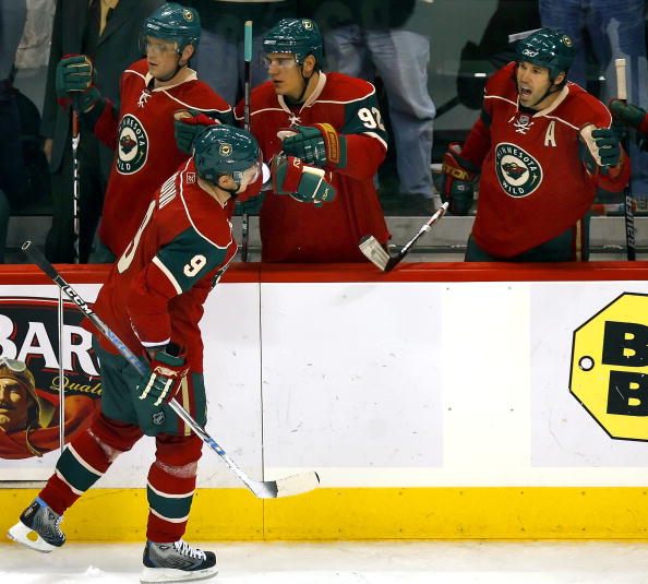 ST. PAUL, MN - OCTOBER 21:  Mikko Koivu #9 of the Minnesota Wild gets high-fives from teammates Marian Gaborik #10, Branko Radivojevic #92 and Brian Rolston #12 after scoring in the third period of their game against the Colorado Avalanche at the Xcel Ene