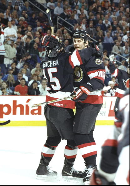 25 Apr 1997:  Centers Shawn McEachern and Alexei Yashin of the Ottawa Senators celebrate during a playoff game against the Buffalo Sabres at the Marine Midland Arena in Buffalo, New York.  The Senators won the game 4-1. Mandatory Credit: Rick Stewart  /Al