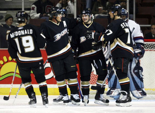 ANAHEIM, CA - SEPTEMBER 22:  (L-R) Andy McDonald, Teemu Selanne, Chris Kunitz and Bruno St. Jacques of the Anaheim Ducks celebrate a goal by Kunitz in the first period against the Vancouver Canucks at the Arrowhead Pond of Anaheim during the preseason gam
