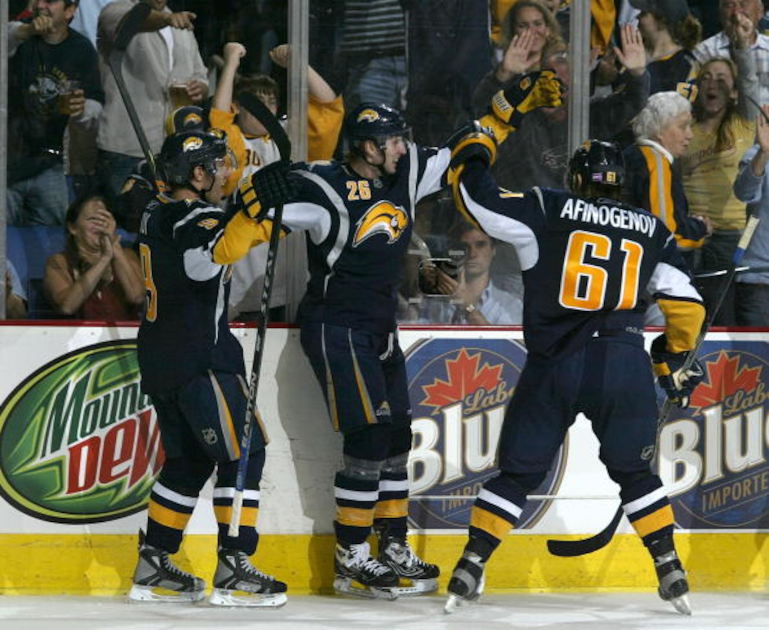 BUFFALO, NY - OCTOBER 05: Thomas Vanek #26 of the Buffalo Sabres celebrate scoring against the New York Islanders with teamates Maxim Afinogenov #61 and Derek Roy #9 on October 5, 2007 at HSBC Arena in Buffalo, New York.  (Photo by Rick Stewart/Getty Imag