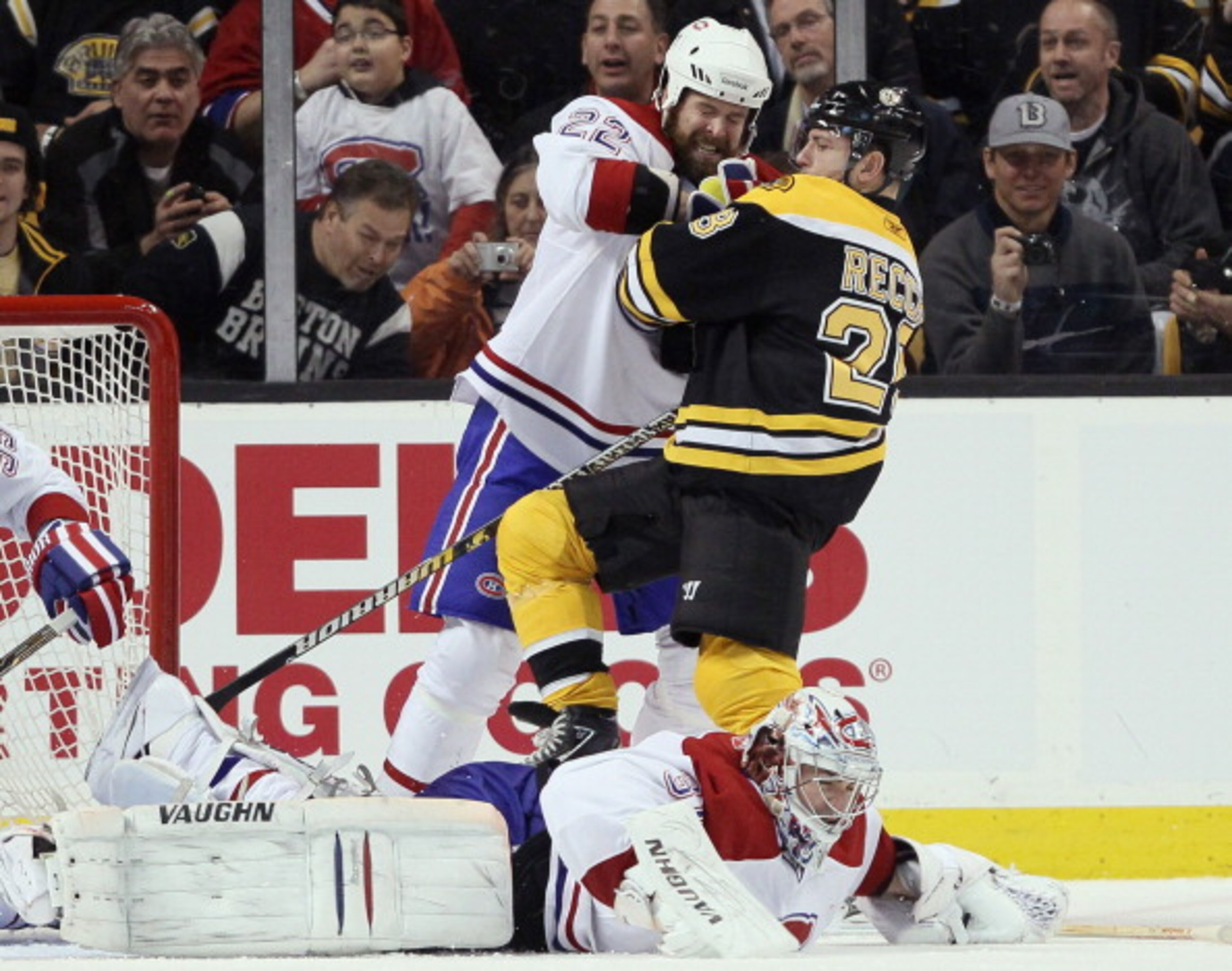 BOSTON, MA - MARCH 24:  Paul Mara #22 of the Montreal Canadiens AND Mark Recchi #28 of the Boston Bruins get in a shoving match as Carey Price #31 stops a shot on March 24, 2011 at the TD Garden in Boston, Massachusetts.  (Photo by Elsa/Getty Images)