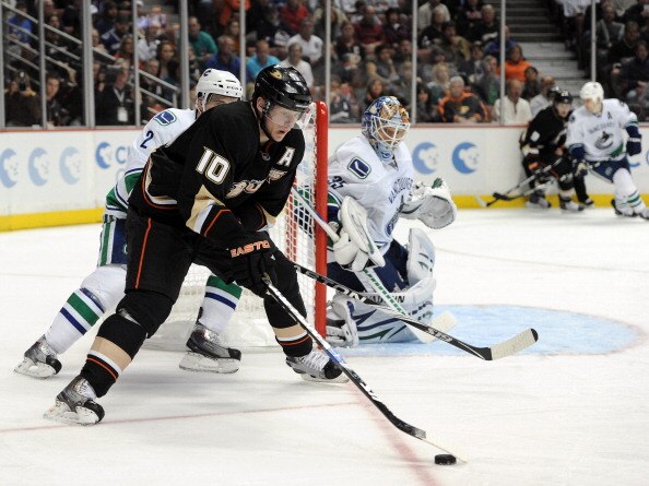 ANAHEIM, CA - MARCH 06:  Cory Schneider #35 of the Vancouver Canucks watches Corey Perry #10 of the Anaheim Ducks as he skates from behind the net at the Honda Center on March 6, 2011 in Anaheim, California.  (Photo by Harry How/Getty Images)