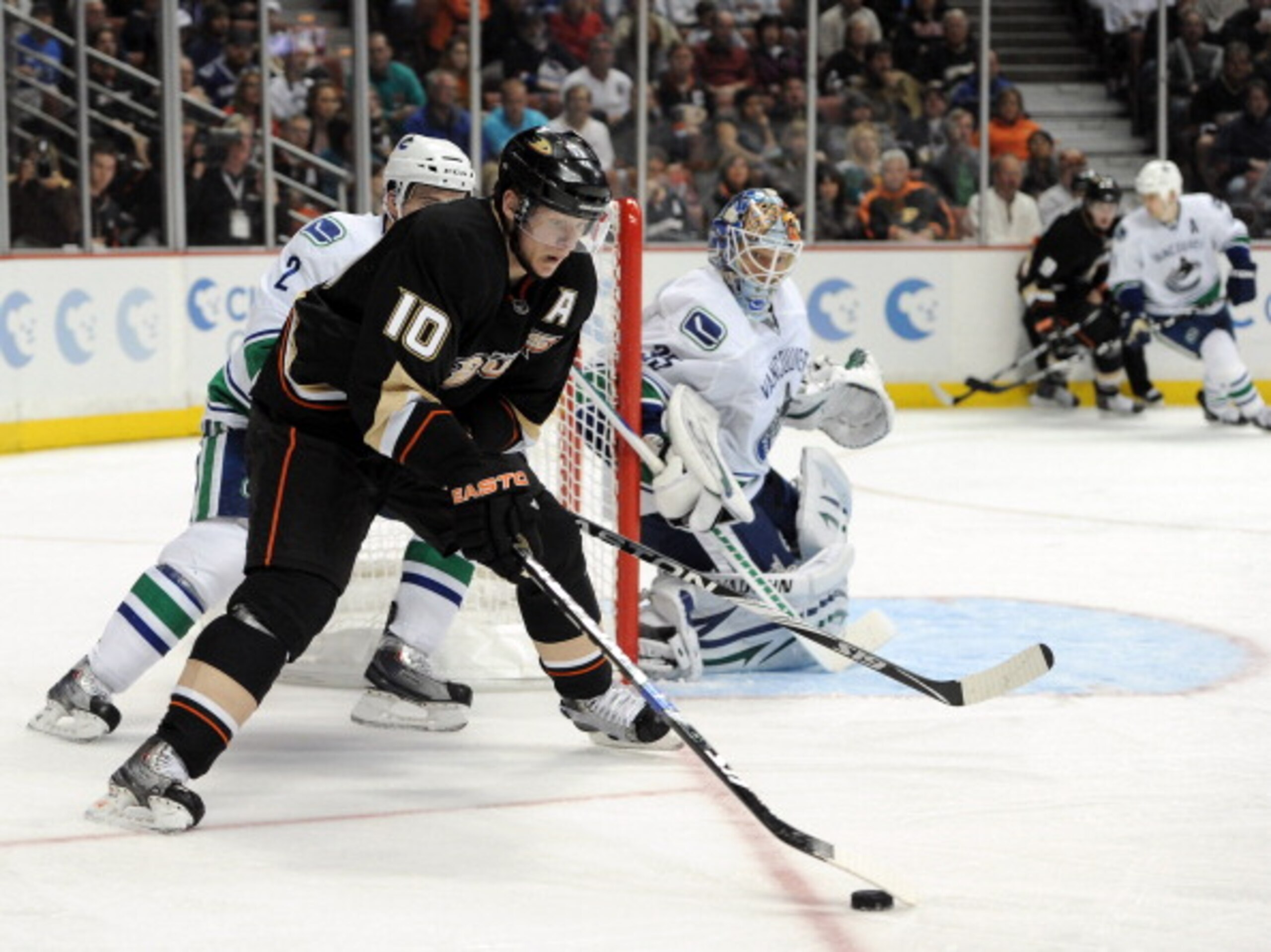 ANAHEIM, CA - MARCH 06:  Cory Schneider #35 of the Vancouver Canucks watches Corey Perry #10 of the Anaheim Ducks as he skates from behind the net at the Honda Center on March 6, 2011 in Anaheim, California.  (Photo by Harry How/Getty Images)