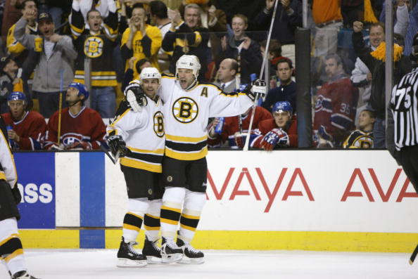 BOSTON, MA - APRIL 21:  Bill Guerin #13 and Don Sweeney #32 of the Boston Bruins celebrate Guerin's goal against the Montreal Canadiens during game two of the Stanley Cup playpoffs at the Fleet Center in Boston, Massachusetts on April 21, 2002. The Bruins