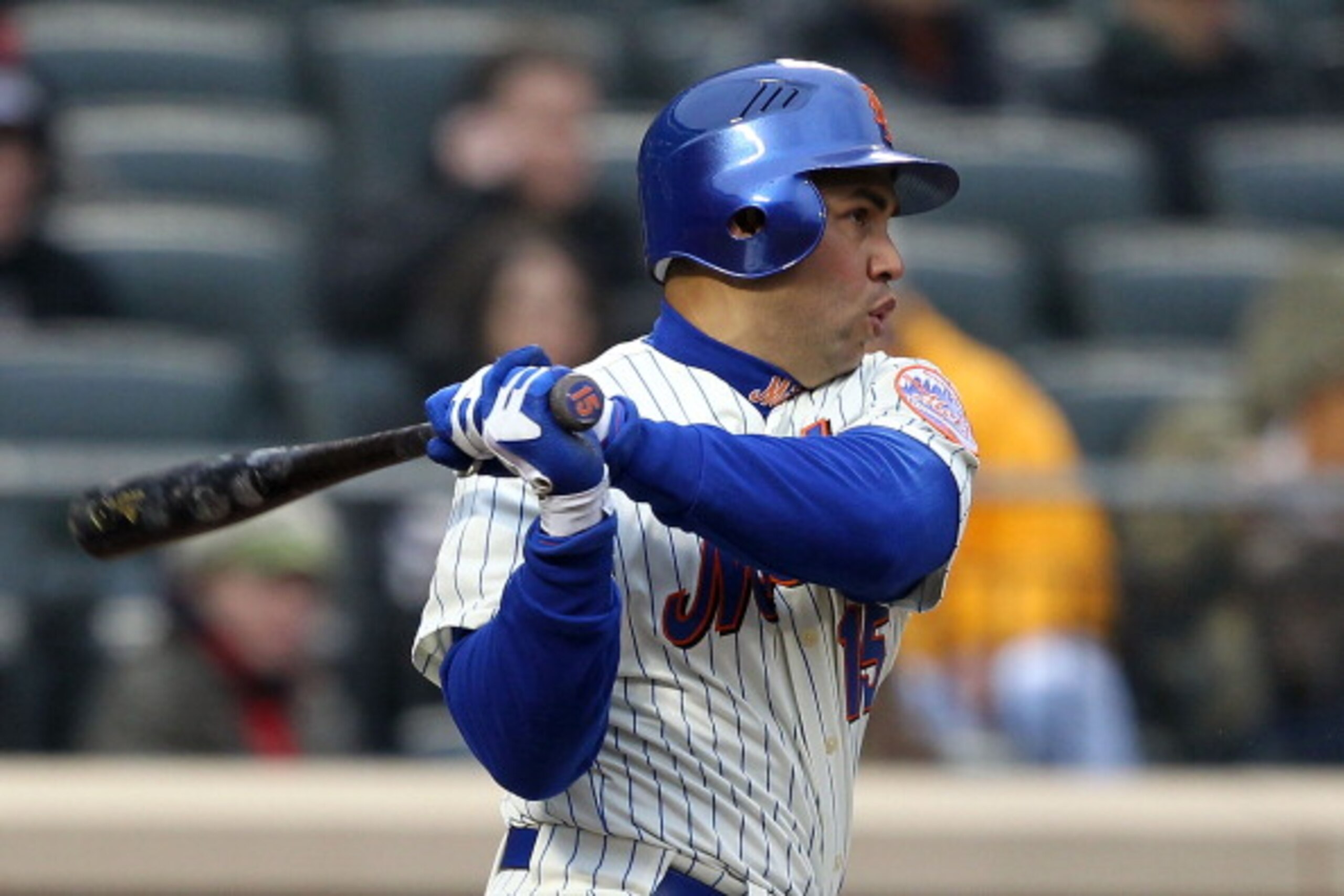 NEW YORK, NY - APRIL 08:  Carlos Beltran #15 of the New York Mets hits a double in the bottom of the sixth inning against the Washington Nationals during the Mets' Home Opener at Citi Field on April 8, 2011 in the Flushing neighborhood of Queens in New Yo